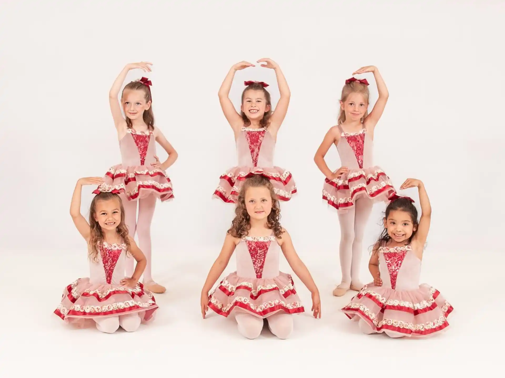 a group of girls wearing dresses