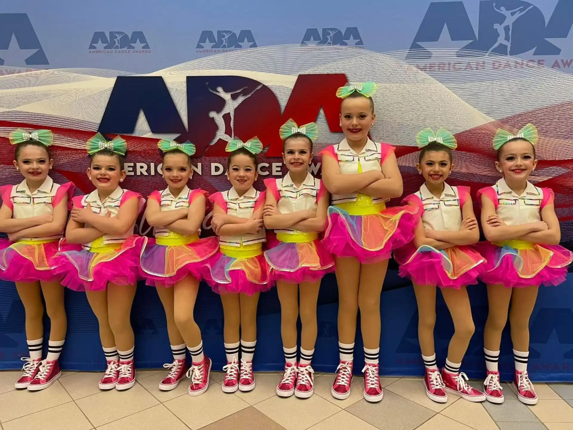 a group of women in colorful dresses