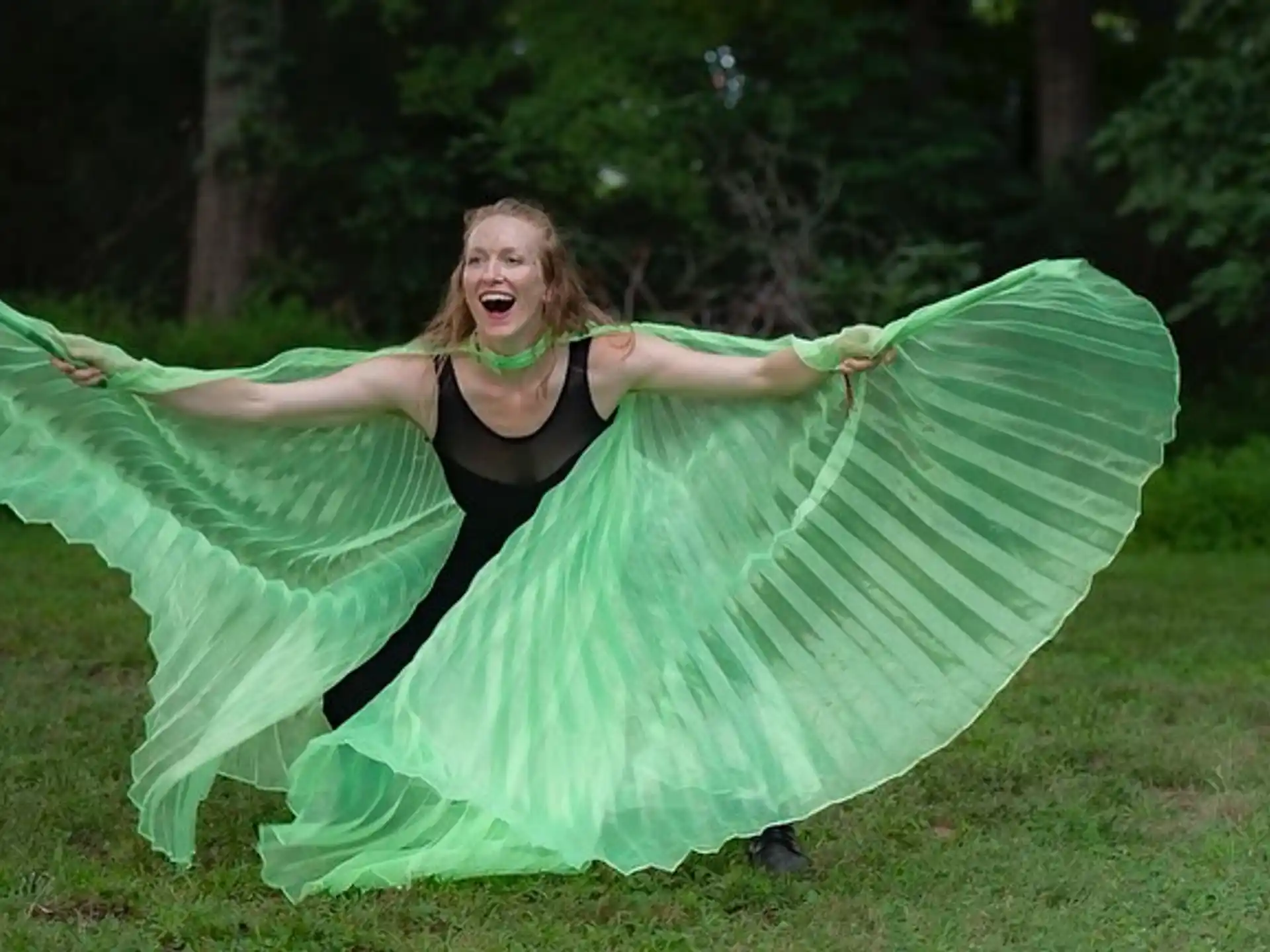 a woman in a green dress