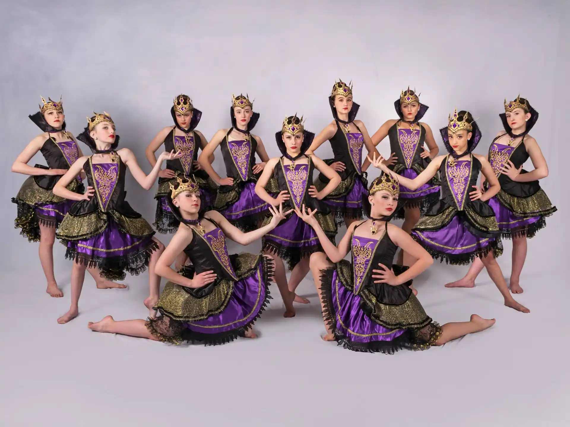 a group of women in colorful dresses