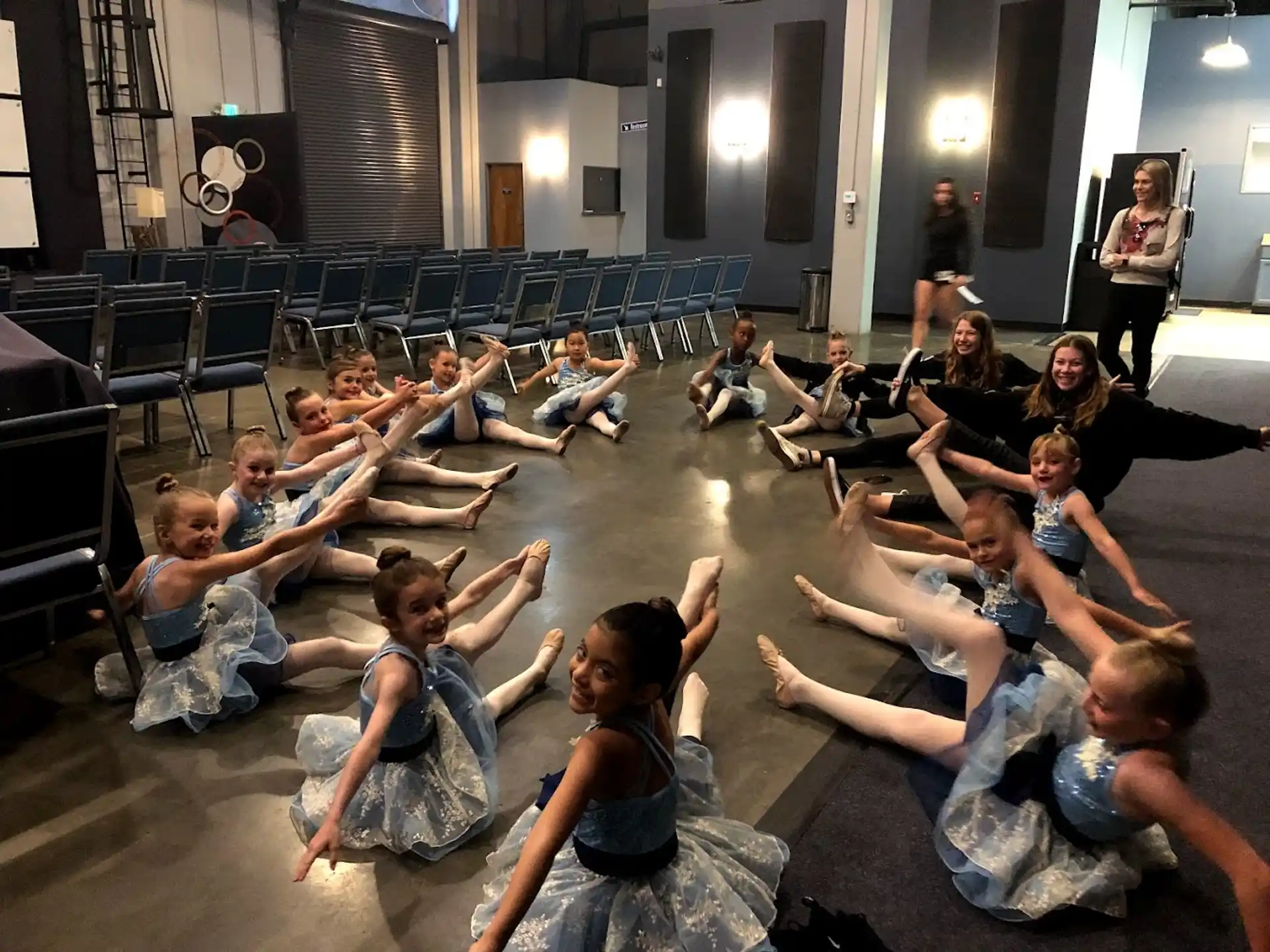 a group of people sitting on the floor