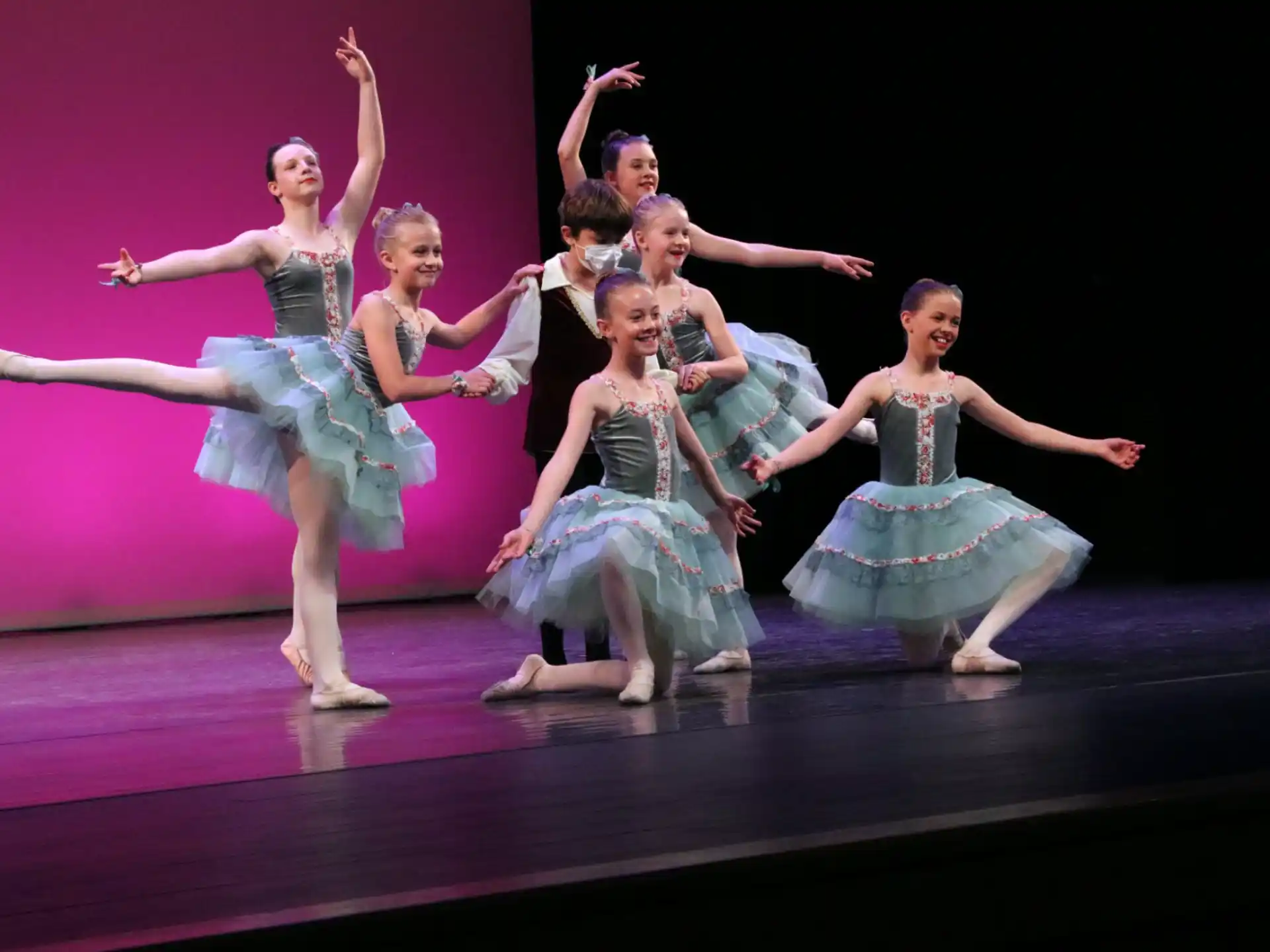 a group of women dancing on a stage