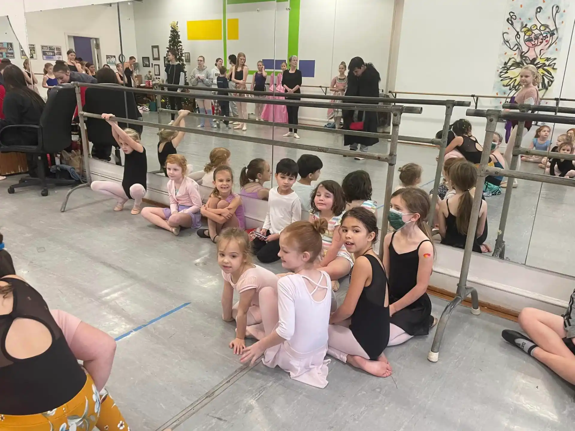 a group of people sitting on the floor