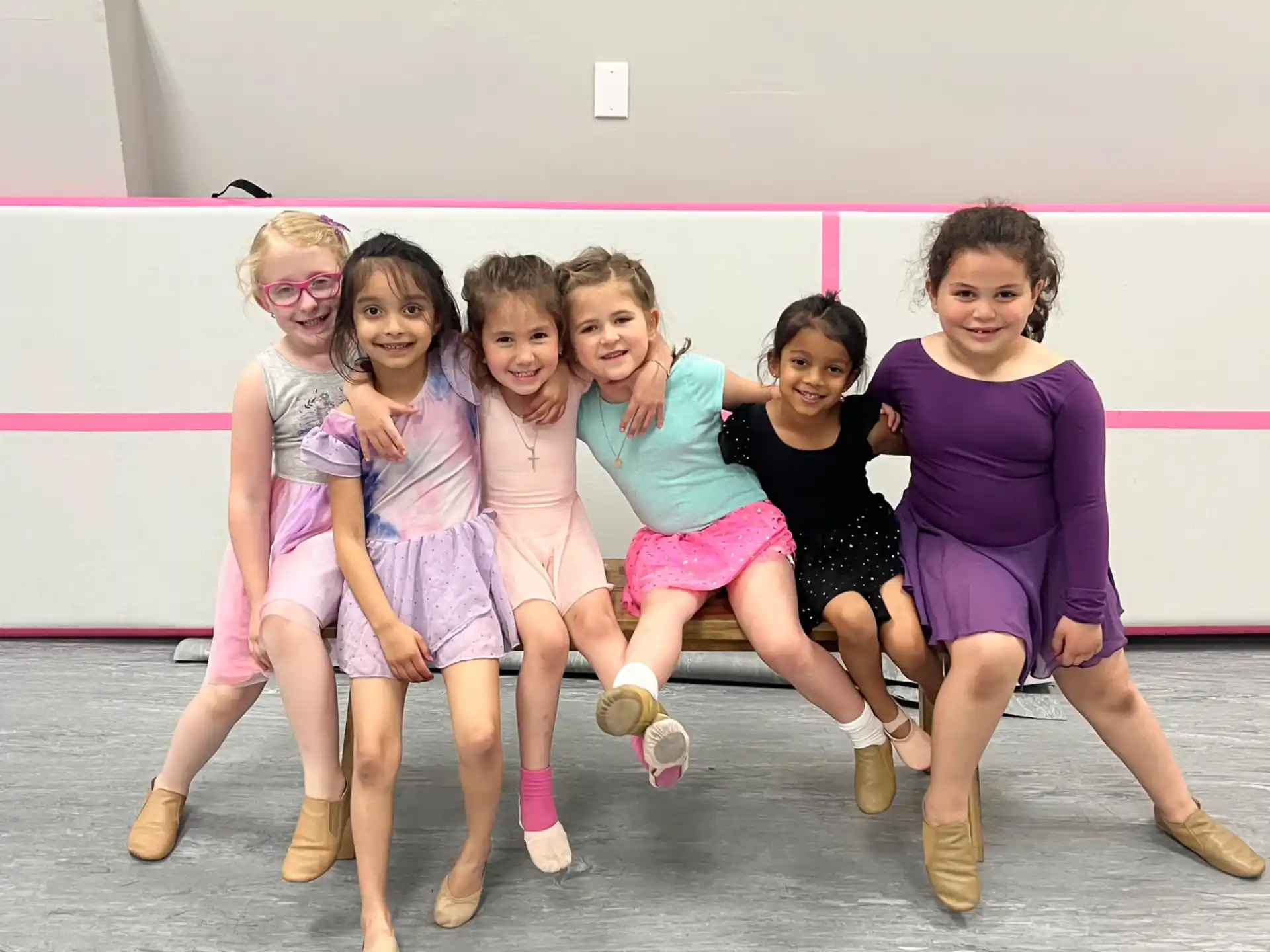 a group of girls posing for a photo