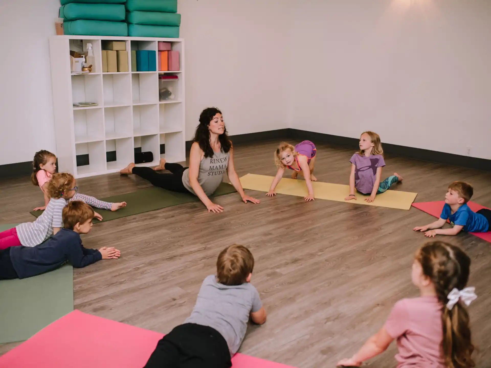 a group of children sitting on the floor