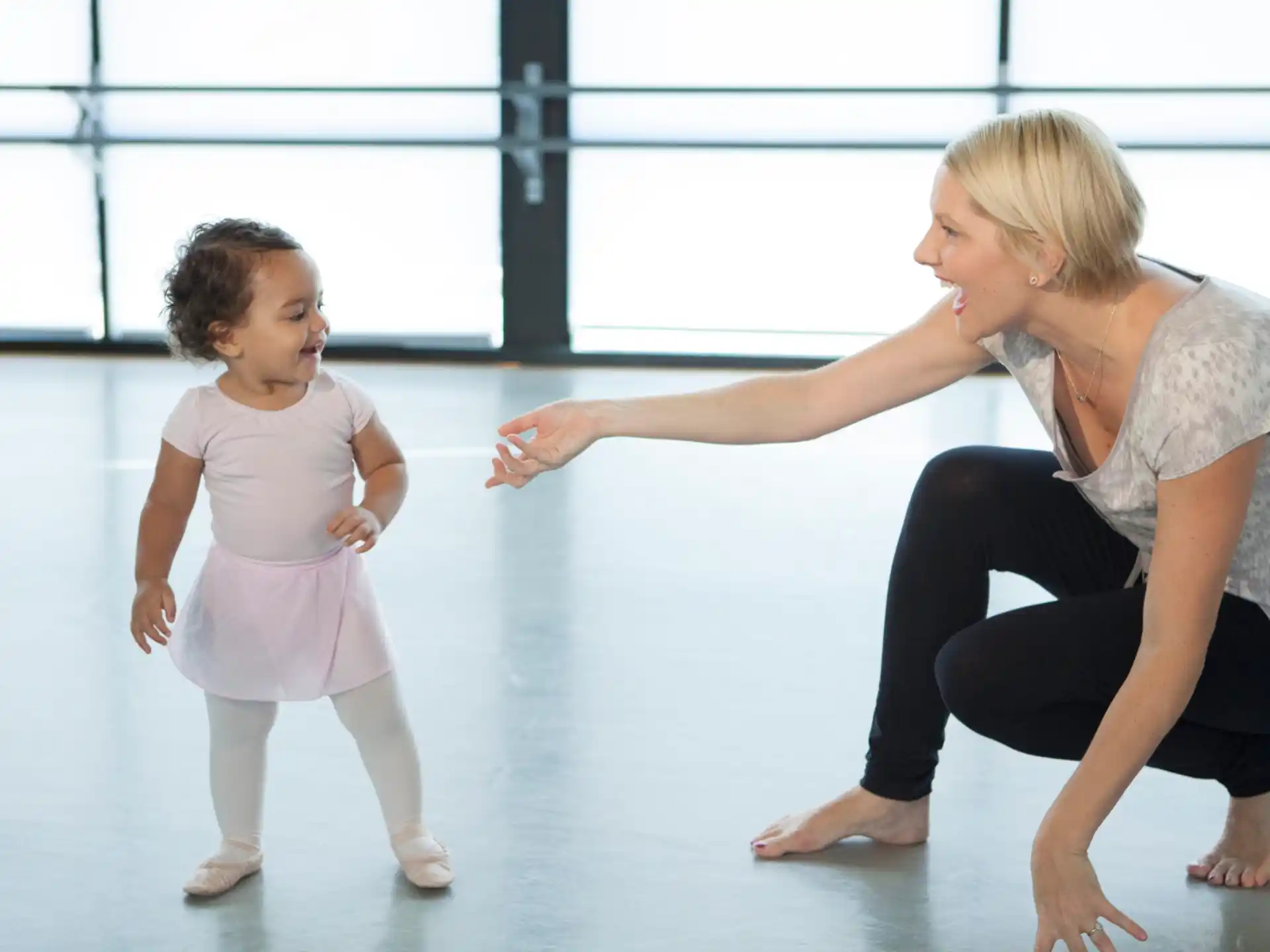 a person and a child dancing