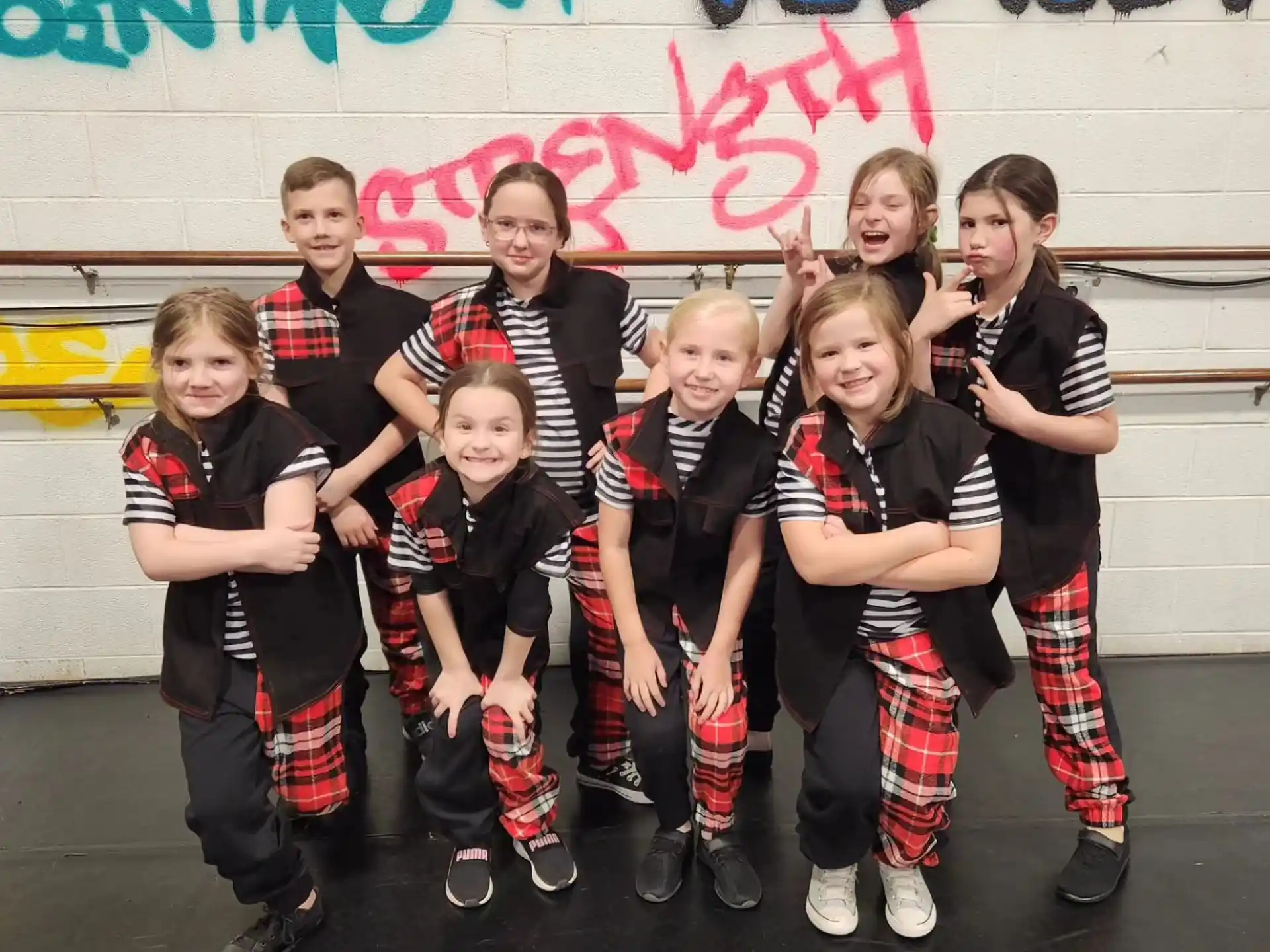 a group of kids posing for a photo