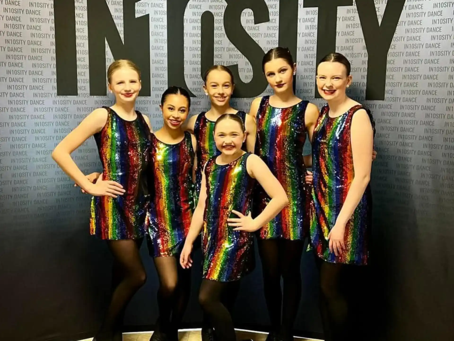 a group of people posing for the camera