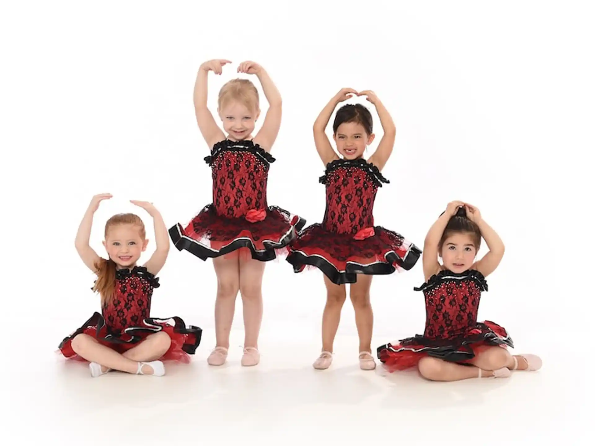 a group of children wearing dresses