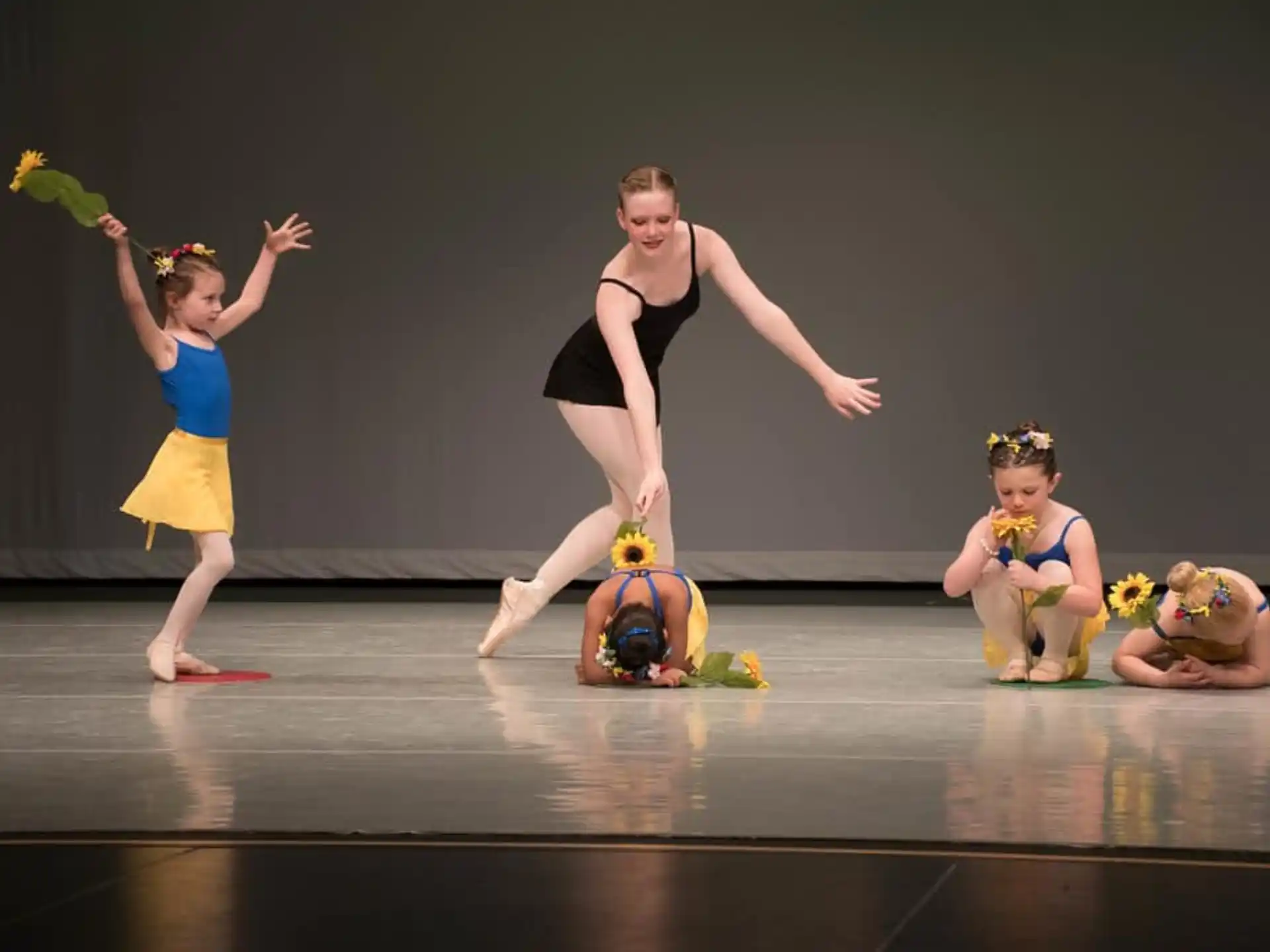 a group of people dancing on a stage