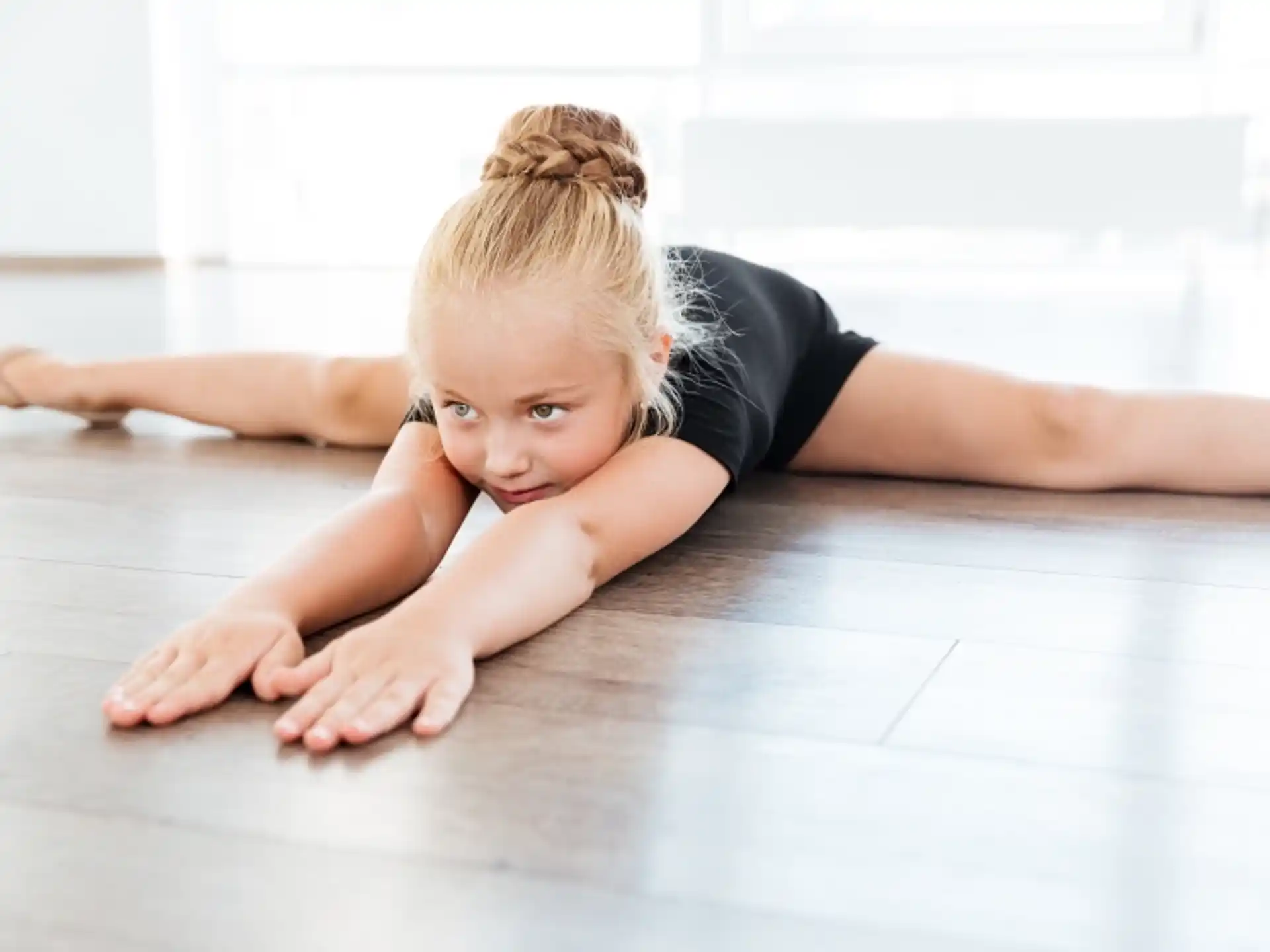 a baby lying on the floor