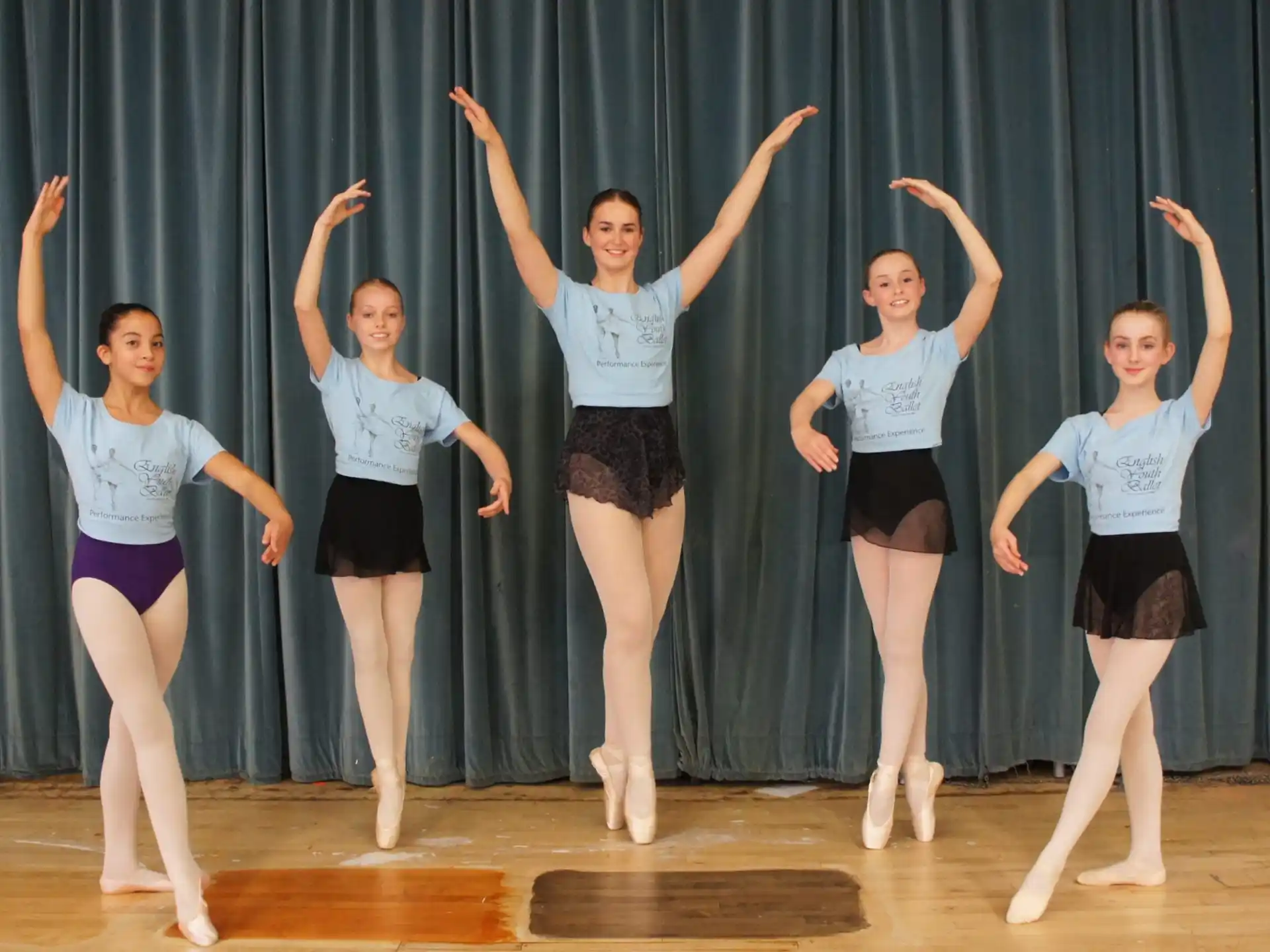 a group of girls on a stage