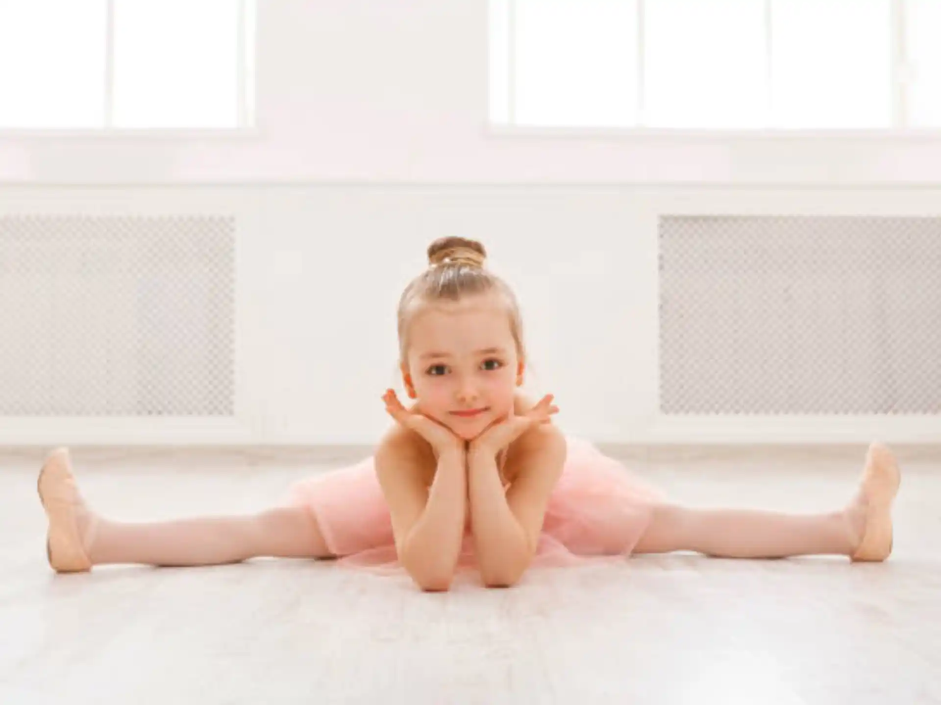 a baby lying on the floor