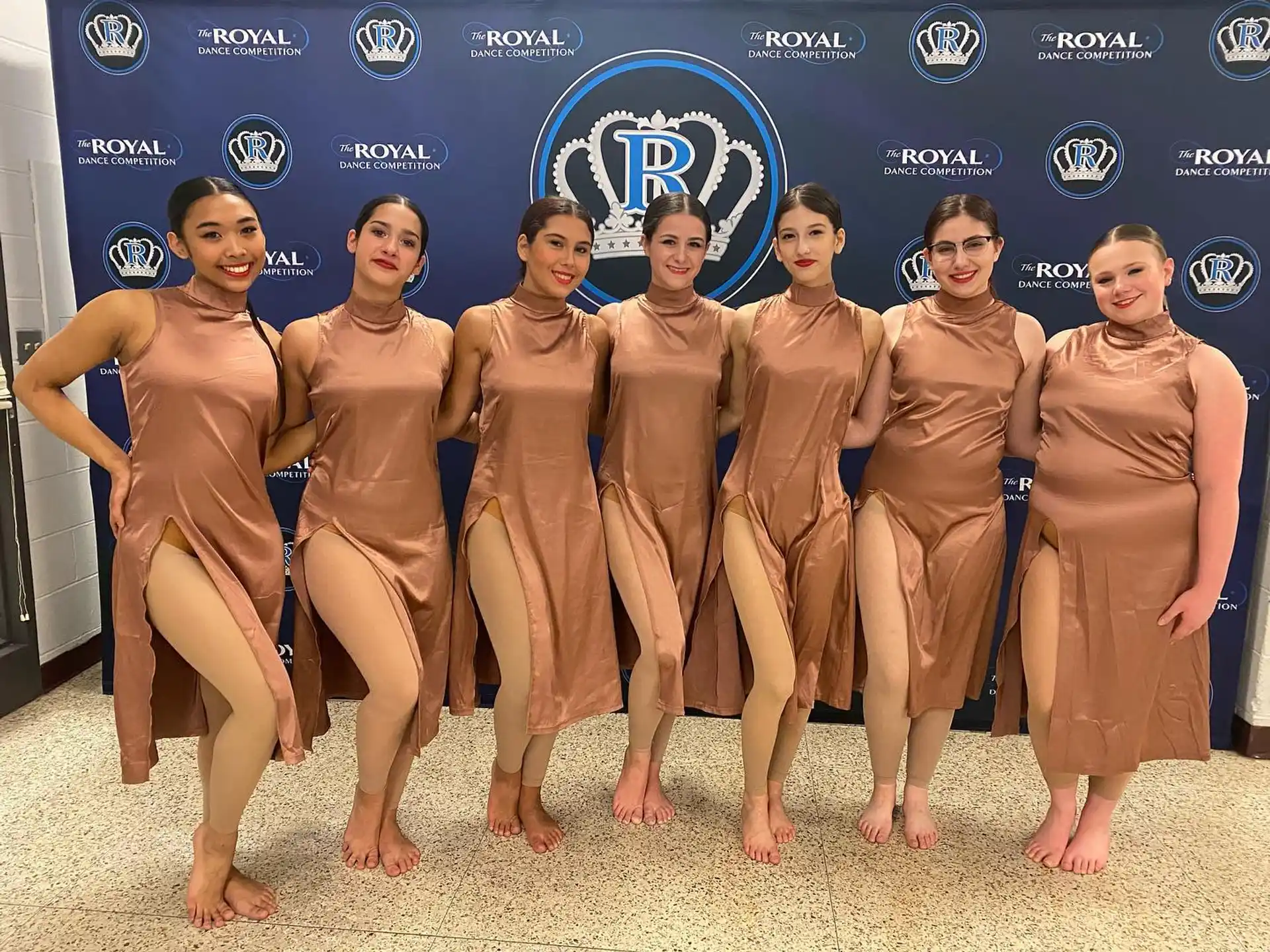 a group of women in swimsuits posing for a photo