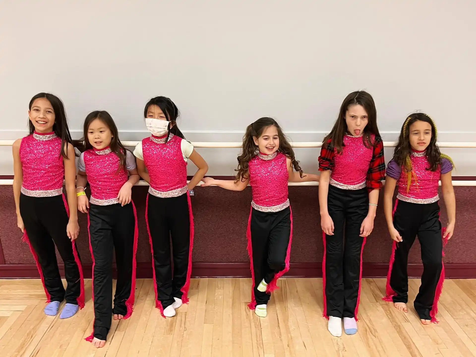 a group of girls posing for a photo