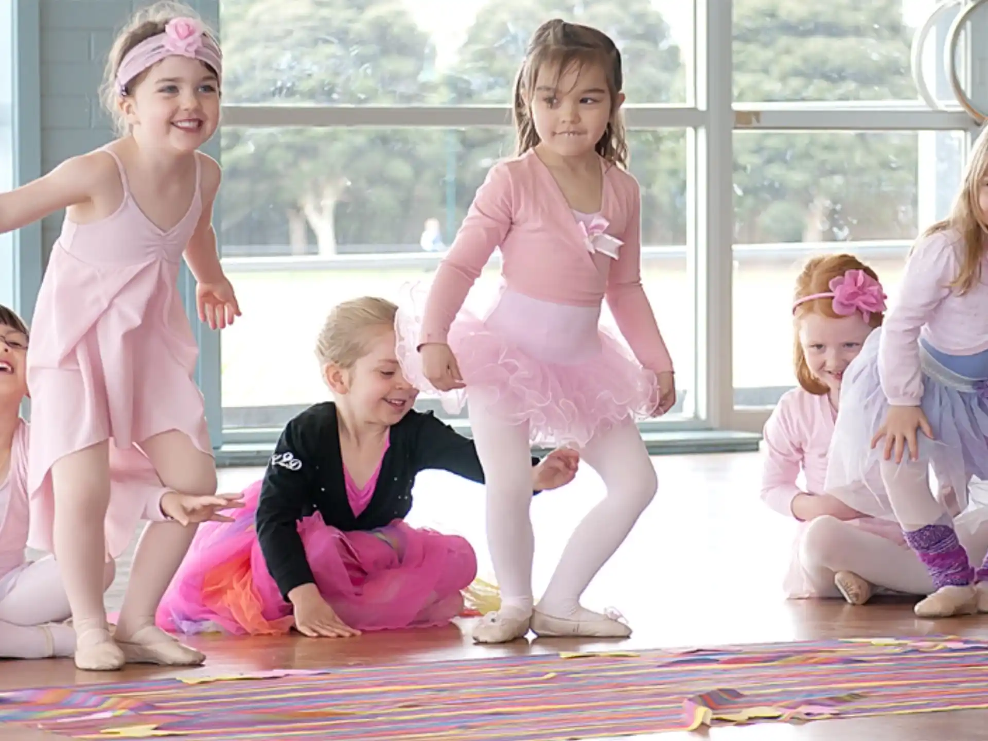 a group of girls in dresses