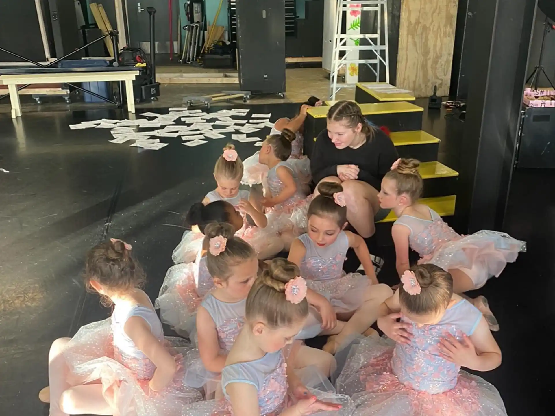 a group of people sitting on the floor
