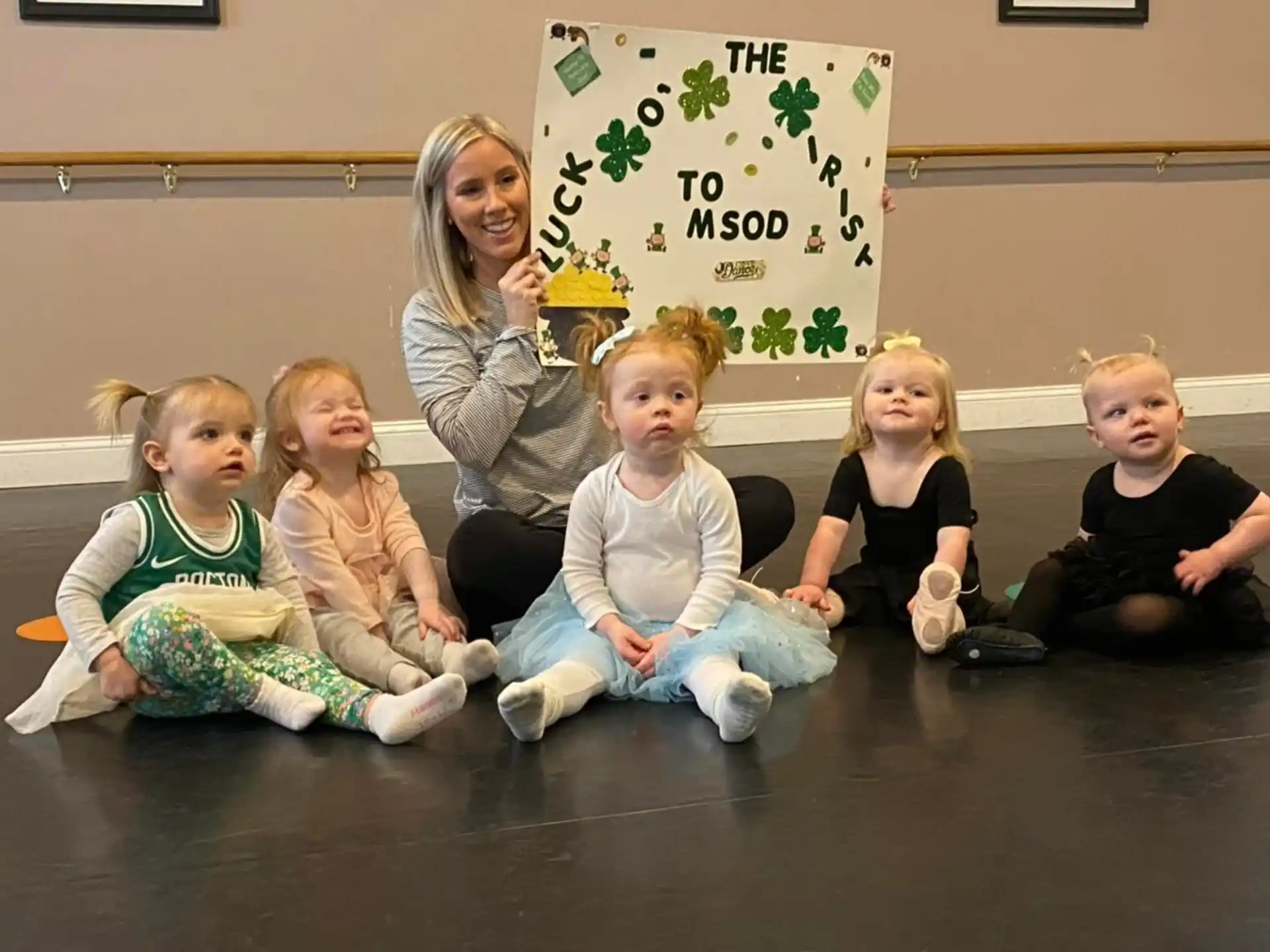 a group of children sitting on the floor