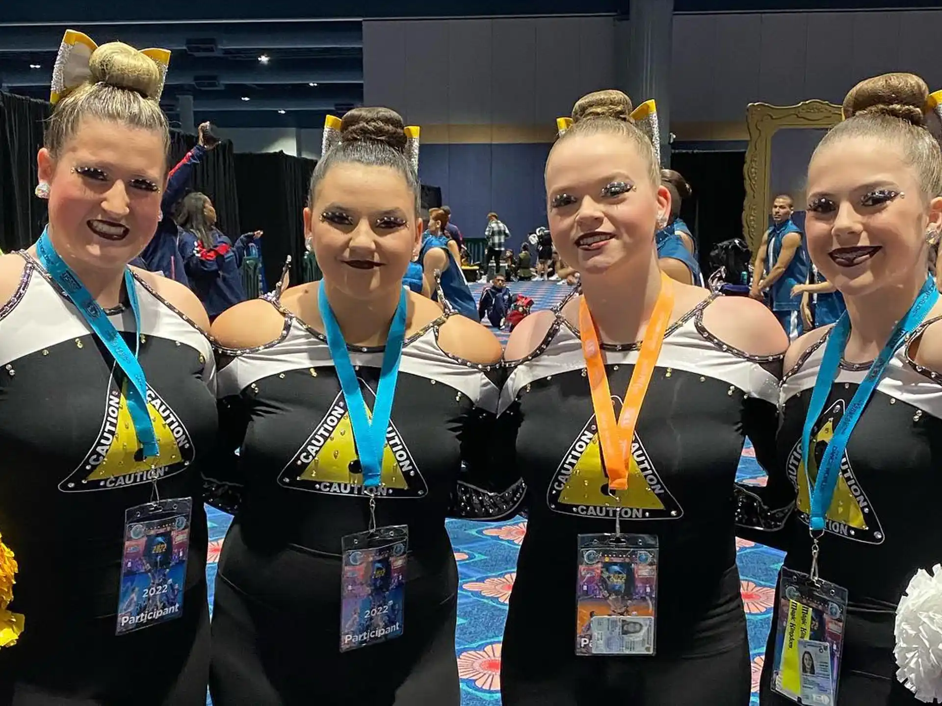 a group of women wearing medals