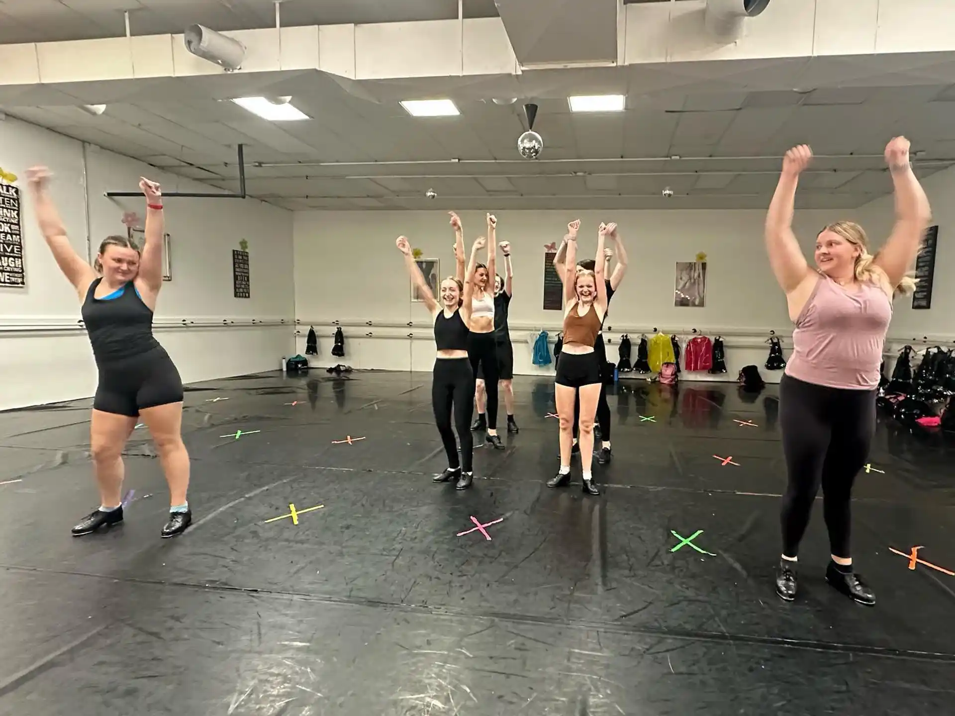 a group of women exercising in a gym