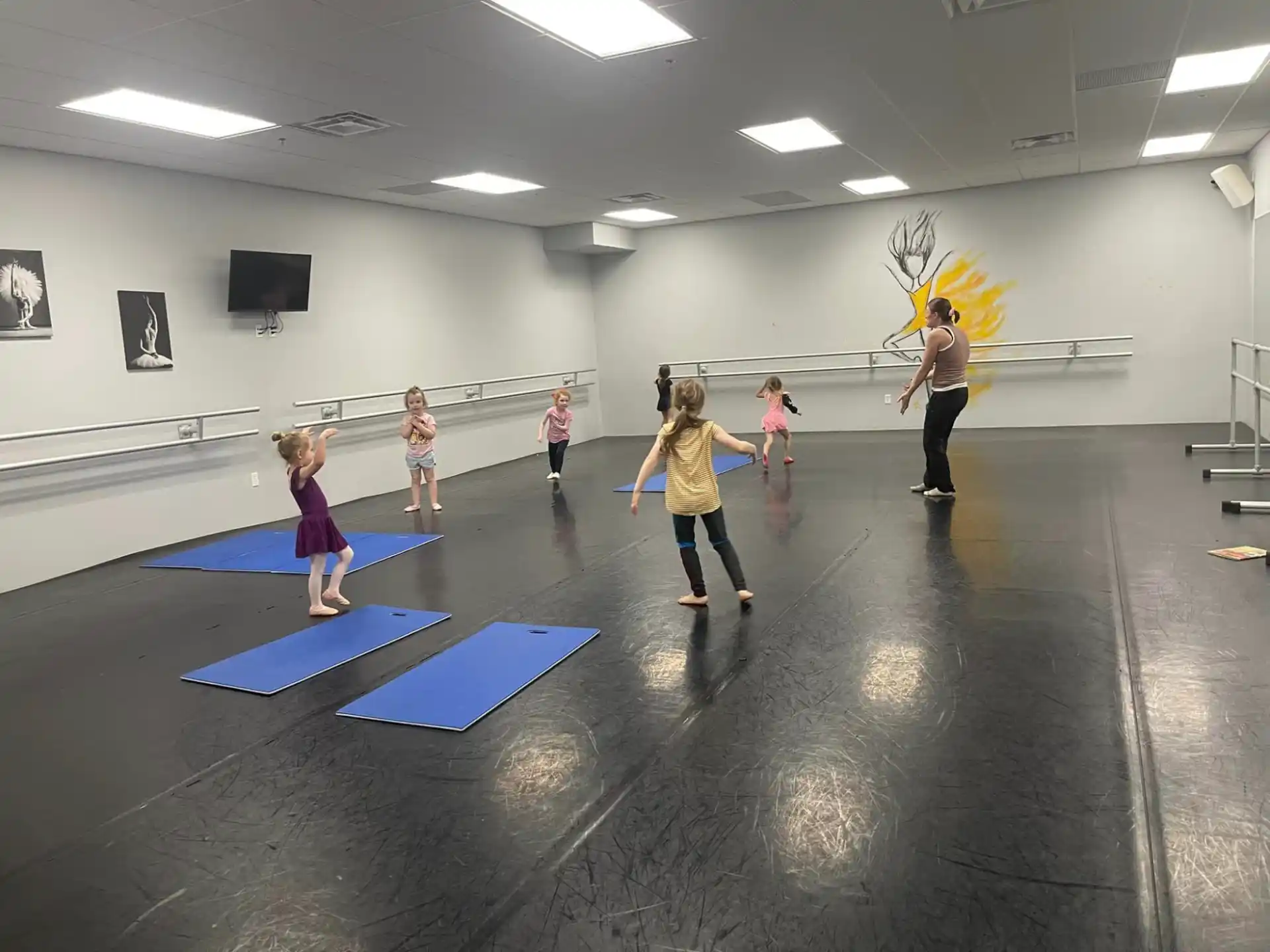 a group of people exercising in a gym
