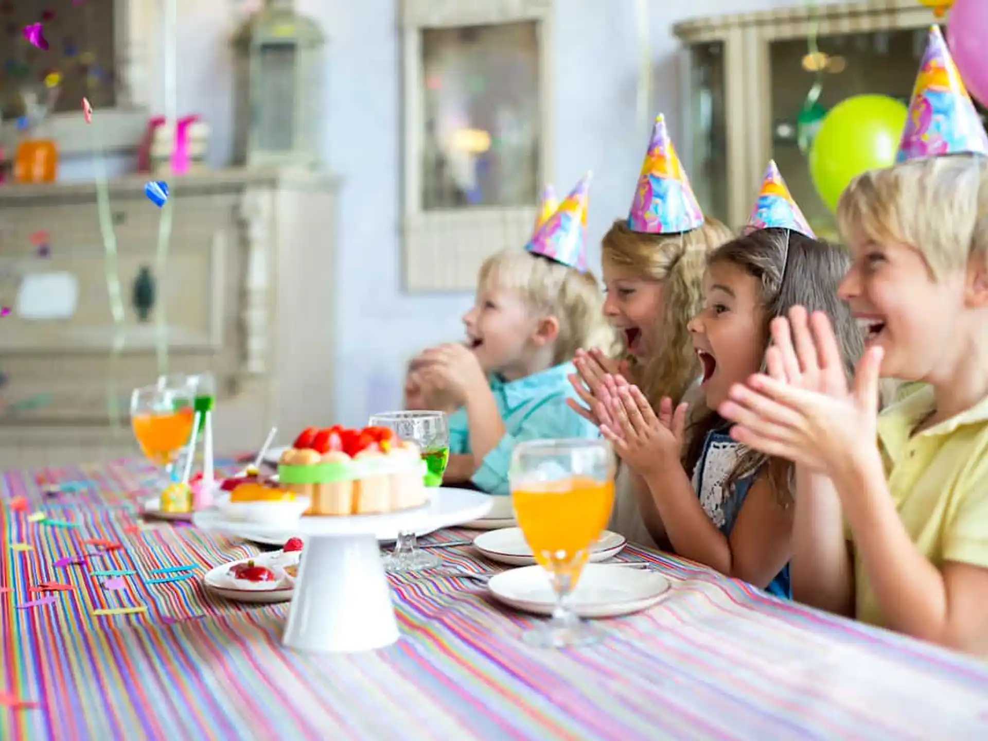 a person and a child with party hats on