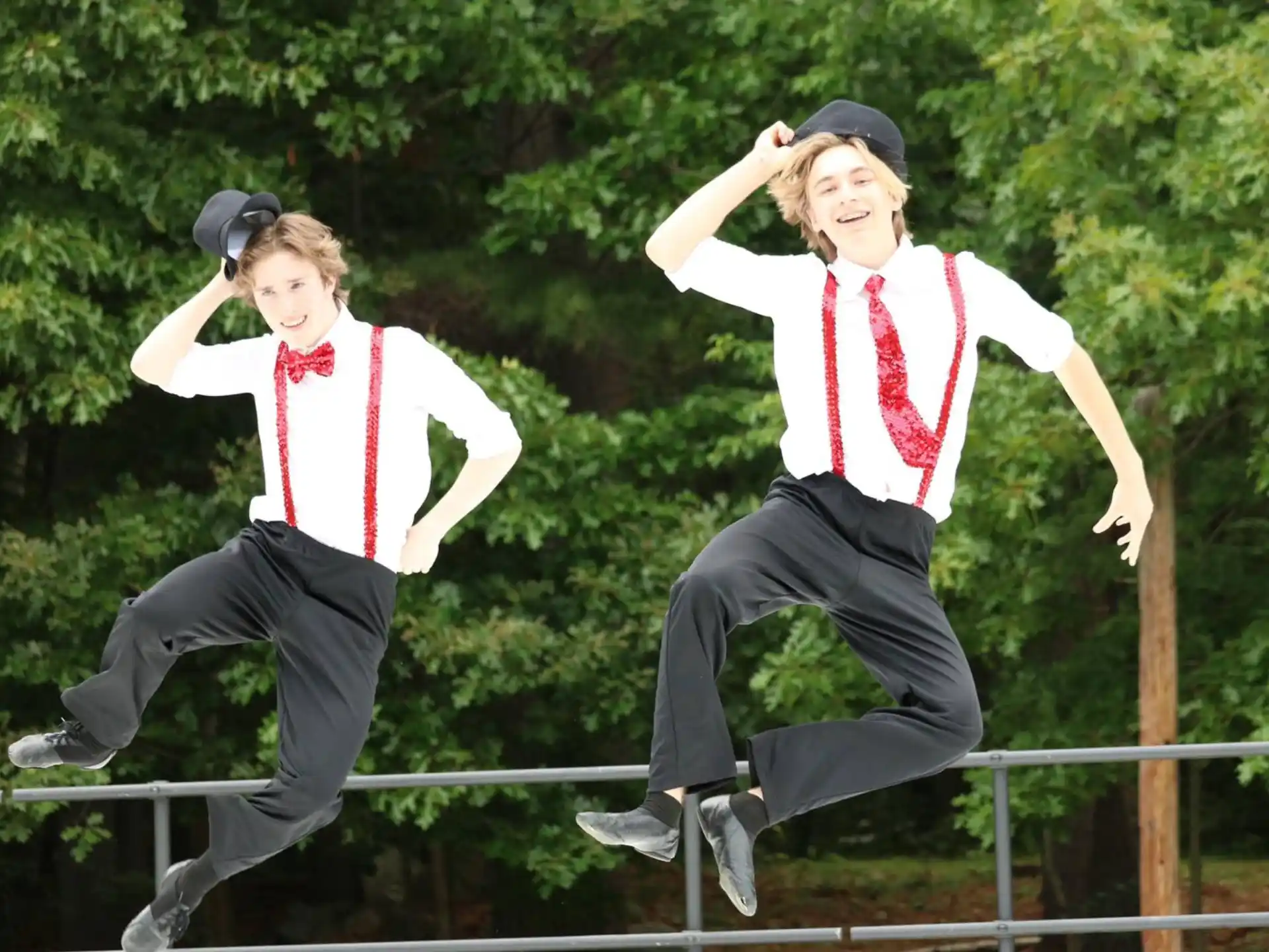two people jumping in the air
