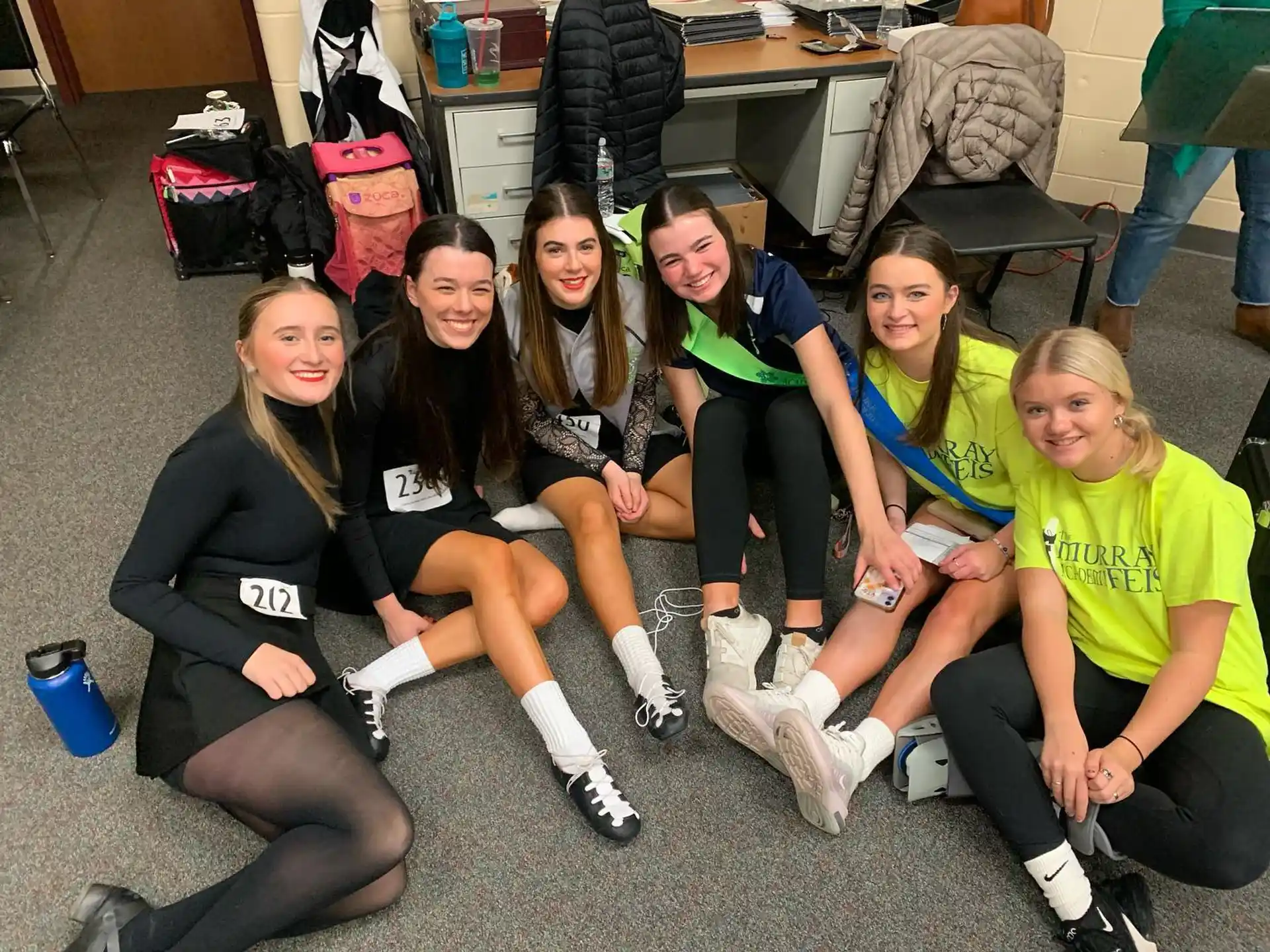 a group of women sitting on the floor