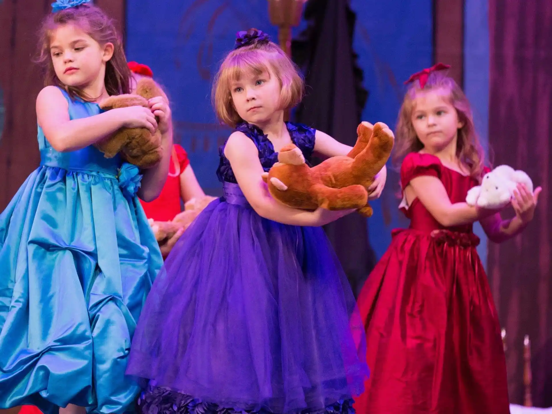 a group of girls in dresses
