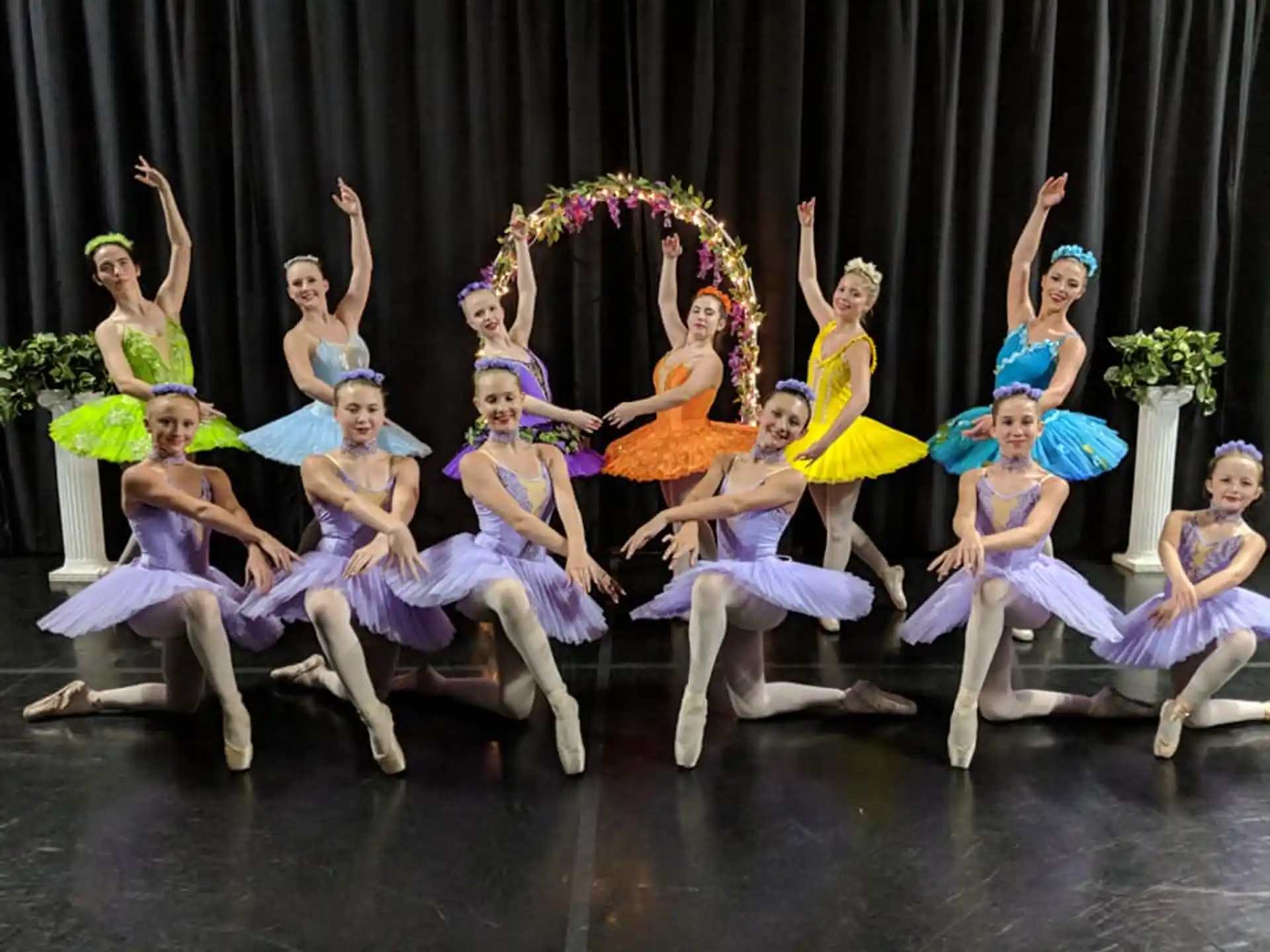 a group of women dancing on a stage