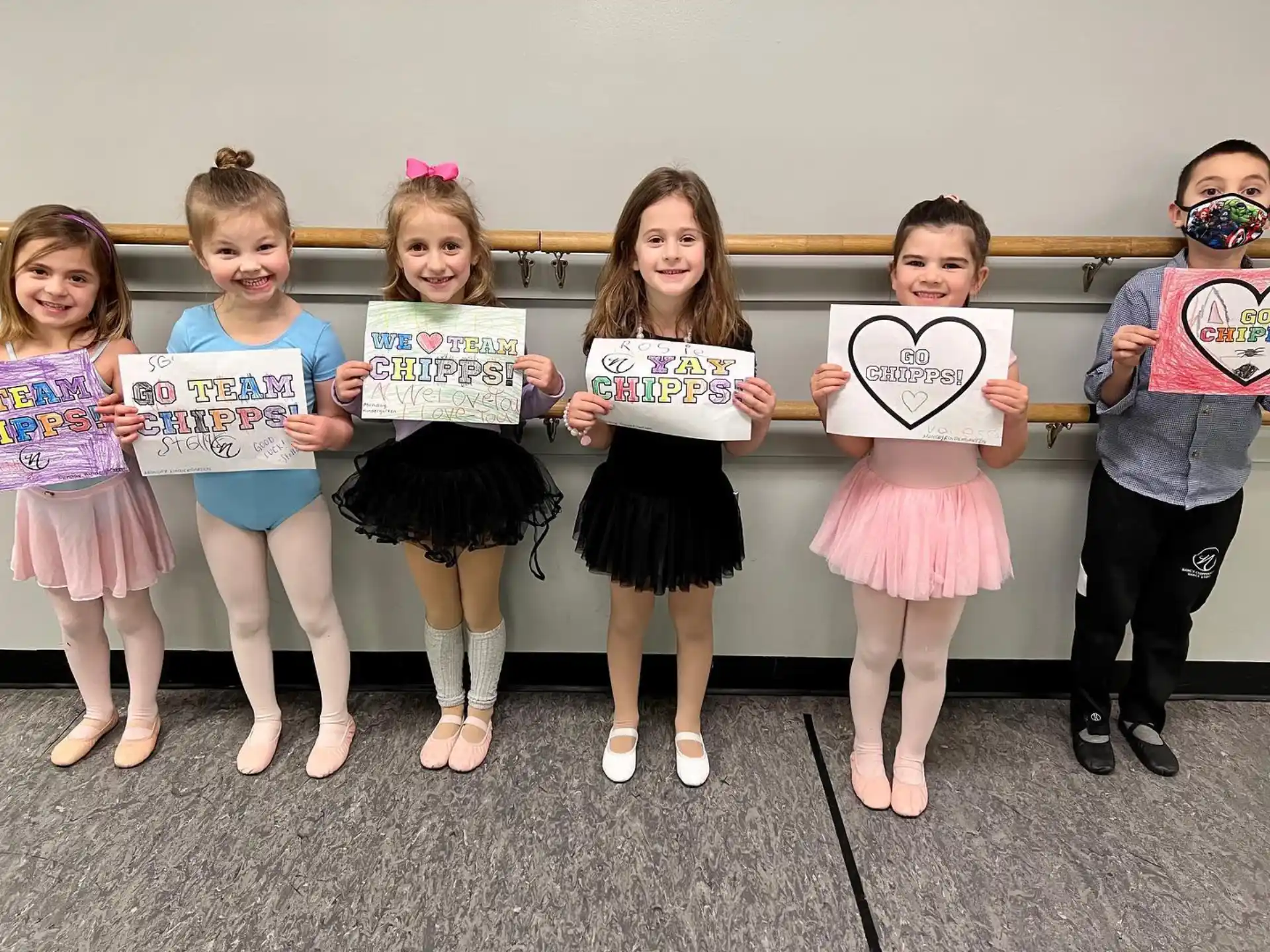 a group of children holding signs