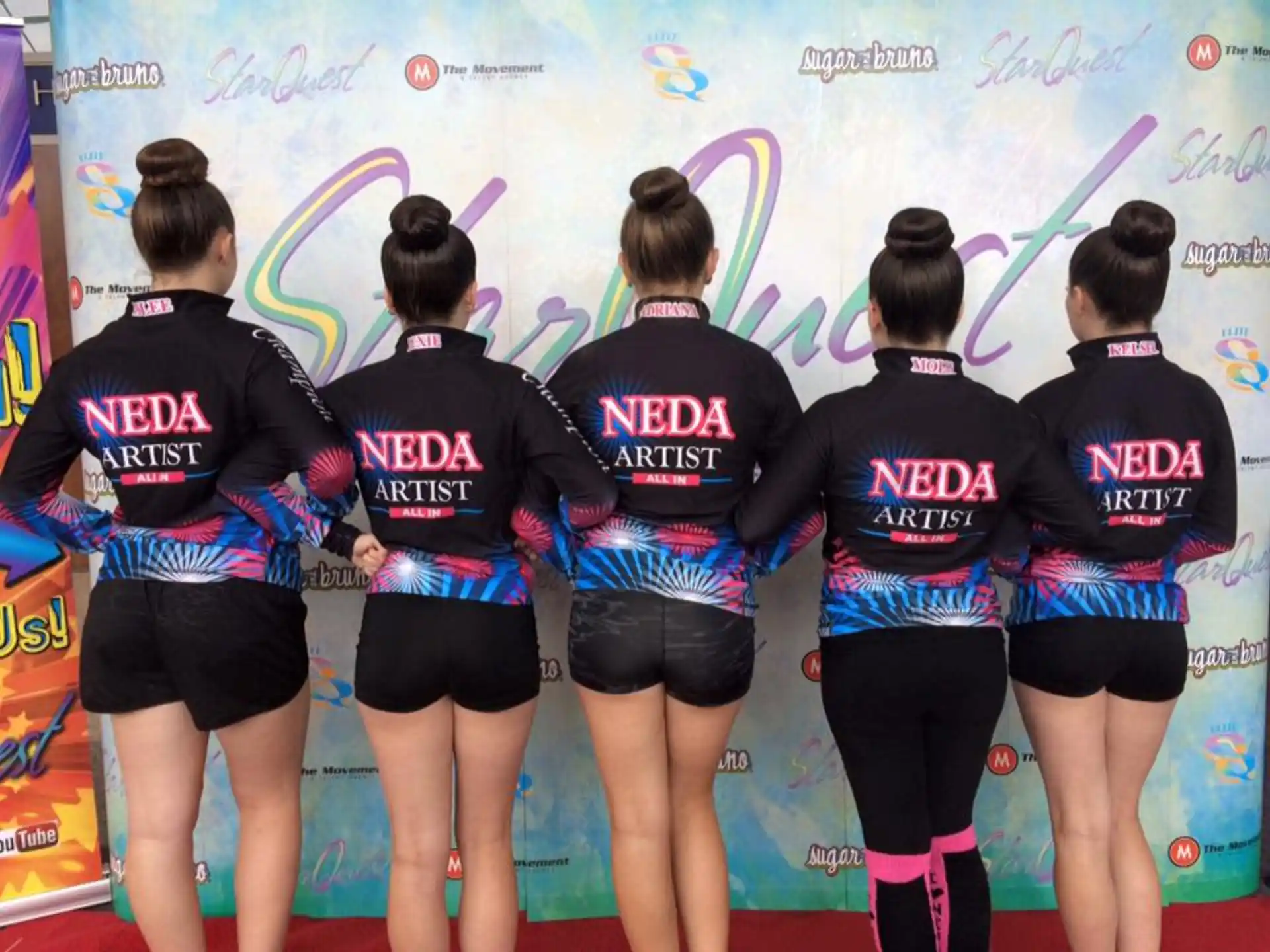 a group of women in athletic wear