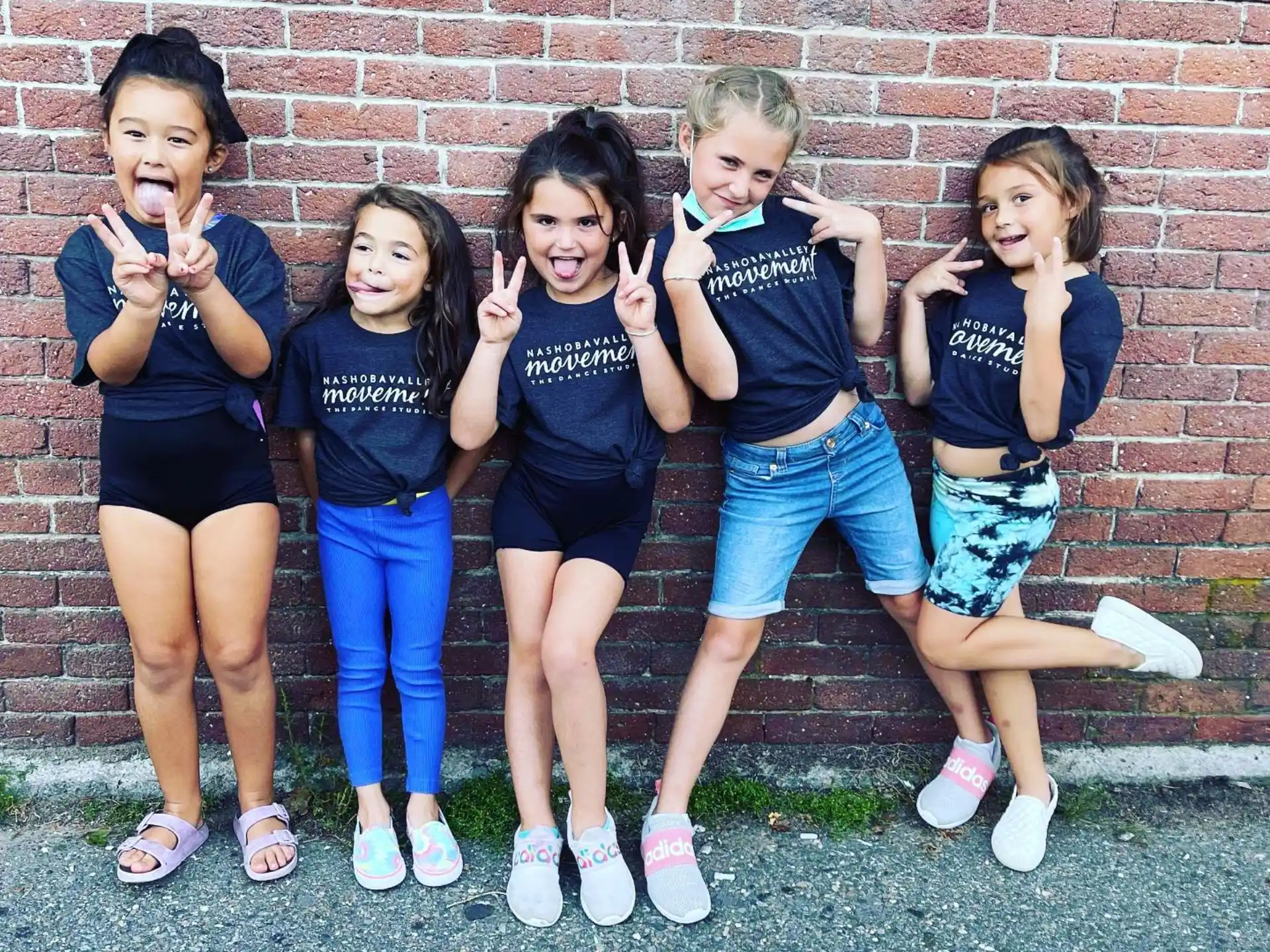 a group of girls posing for a photo
