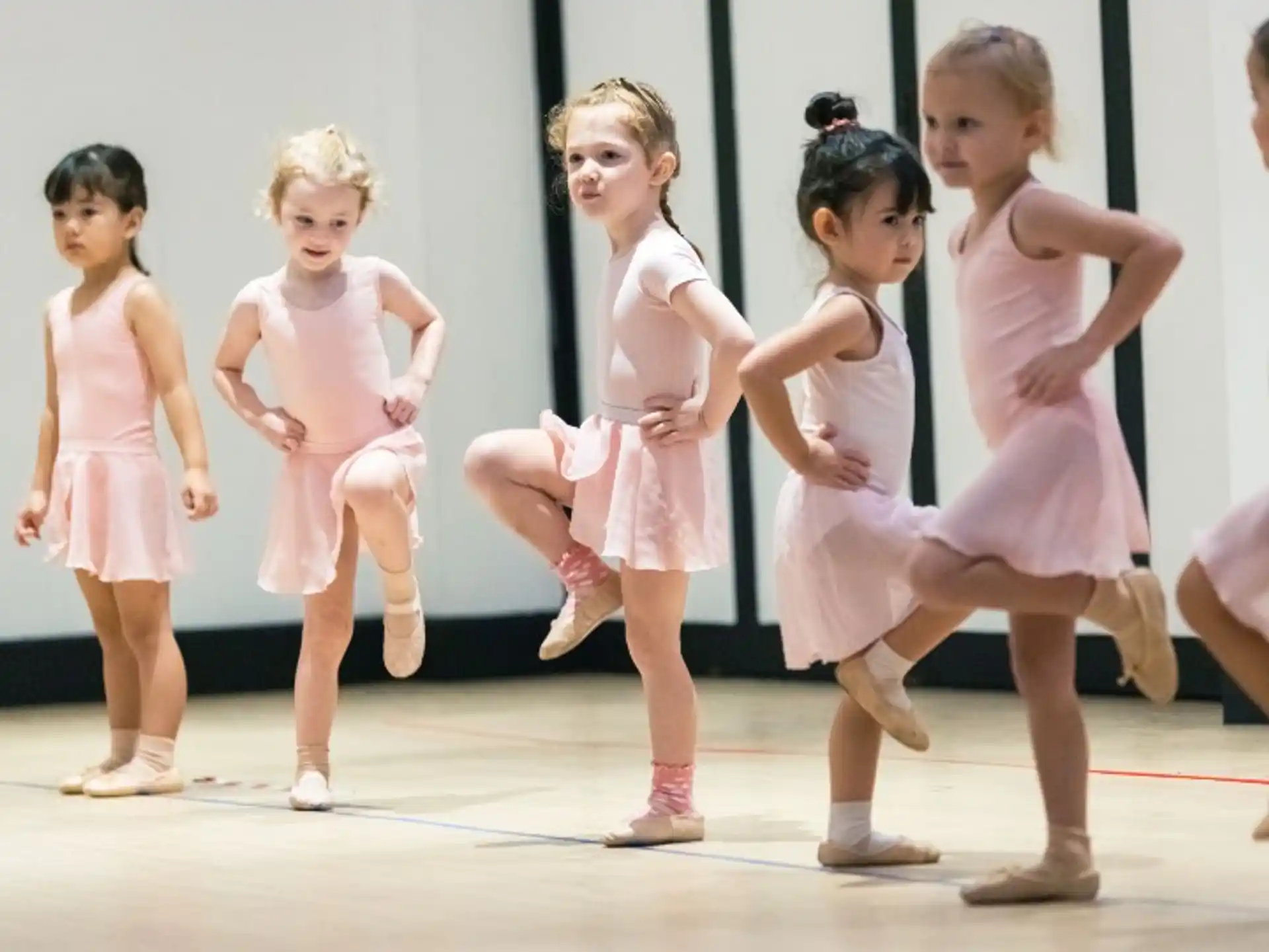a group of girls in dresses