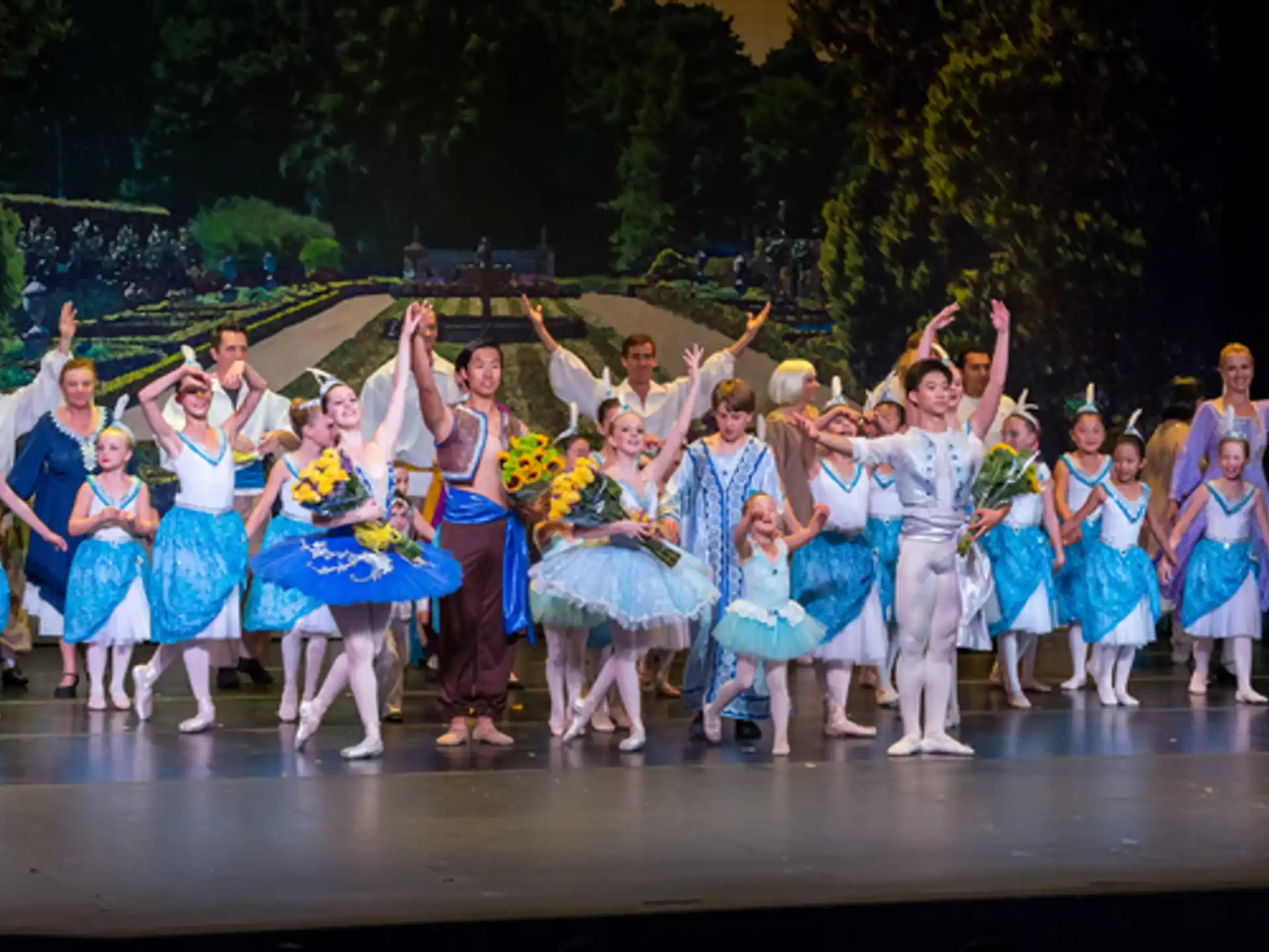 a group of people dancing on a stage