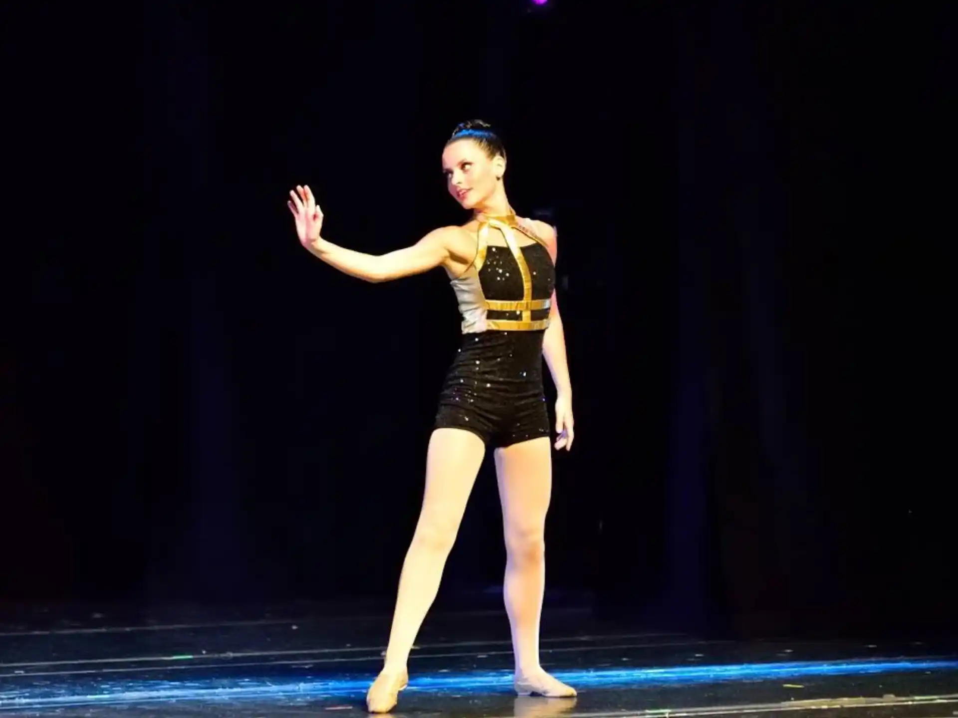 a woman dancing on a stage