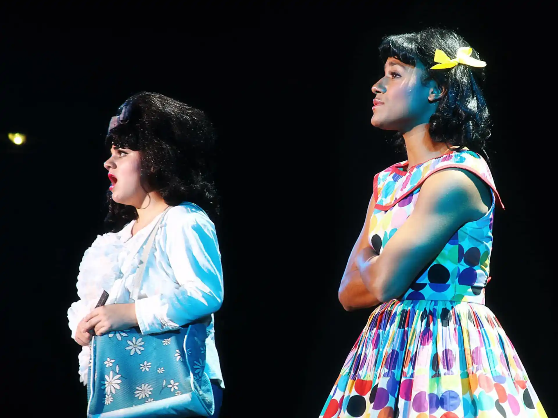 a couple of women in dresses