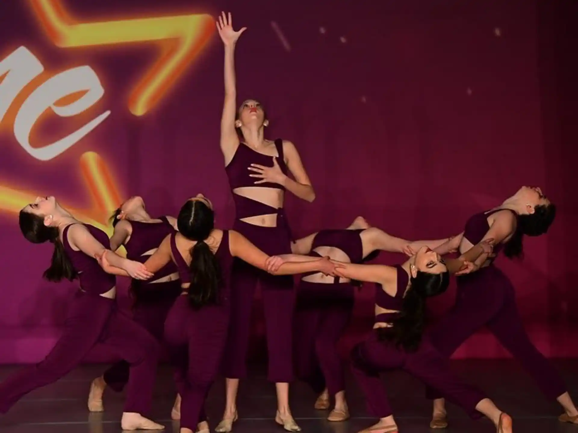 a group of women dancing on a stage