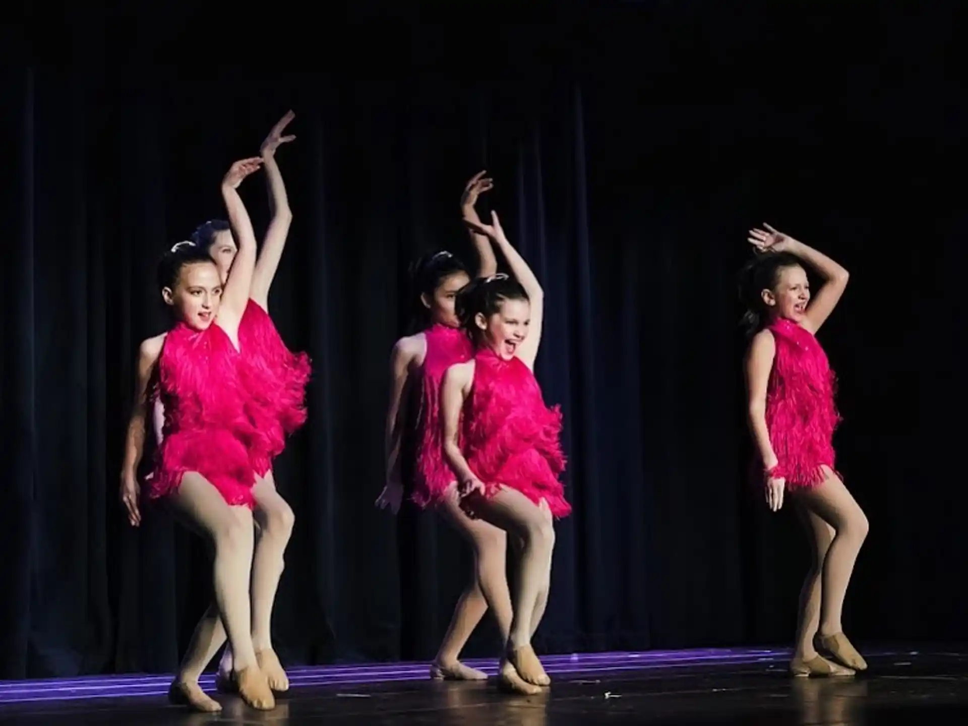 a group of girls on a stage