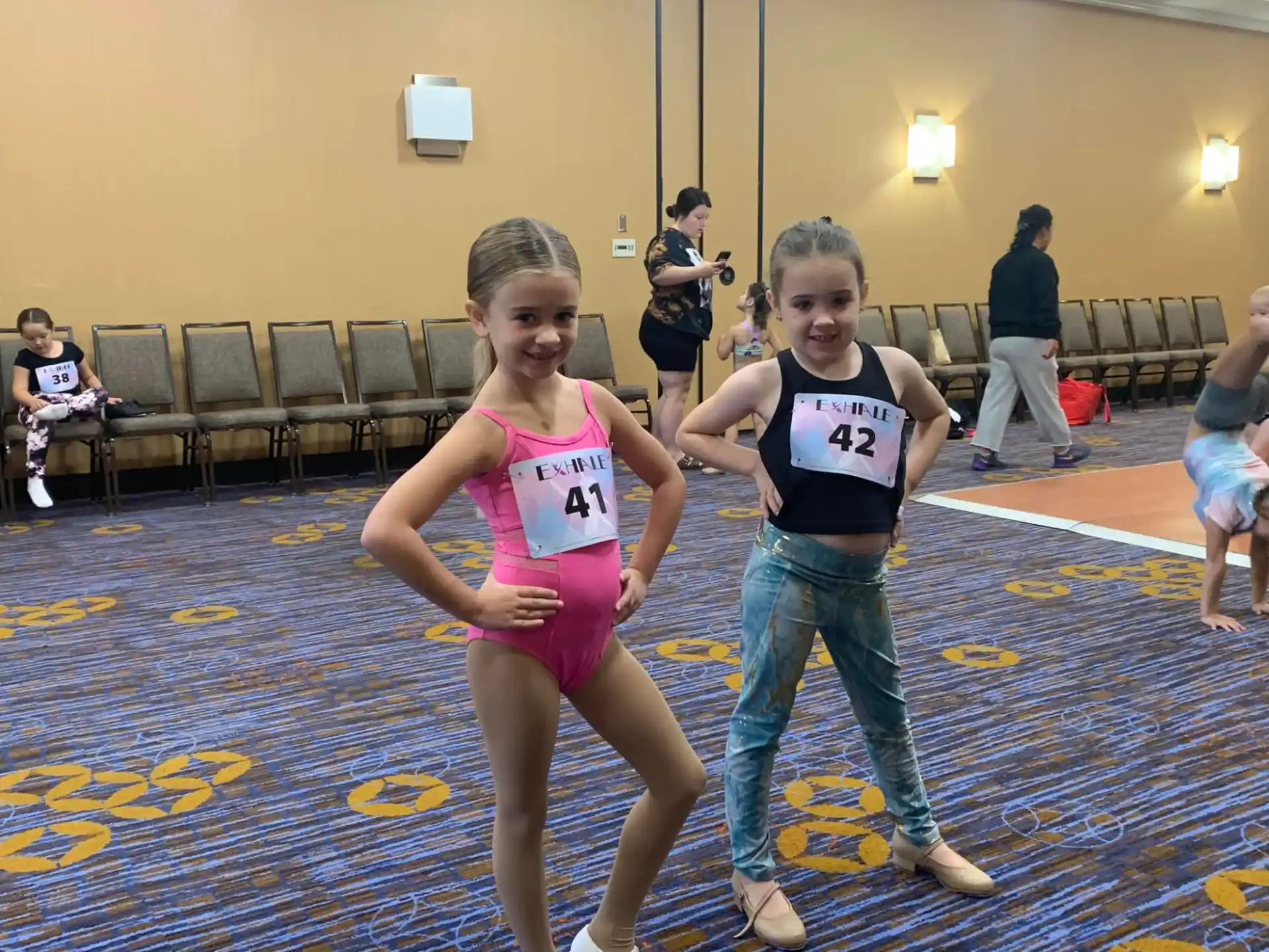 a couple of girls posing for the camera