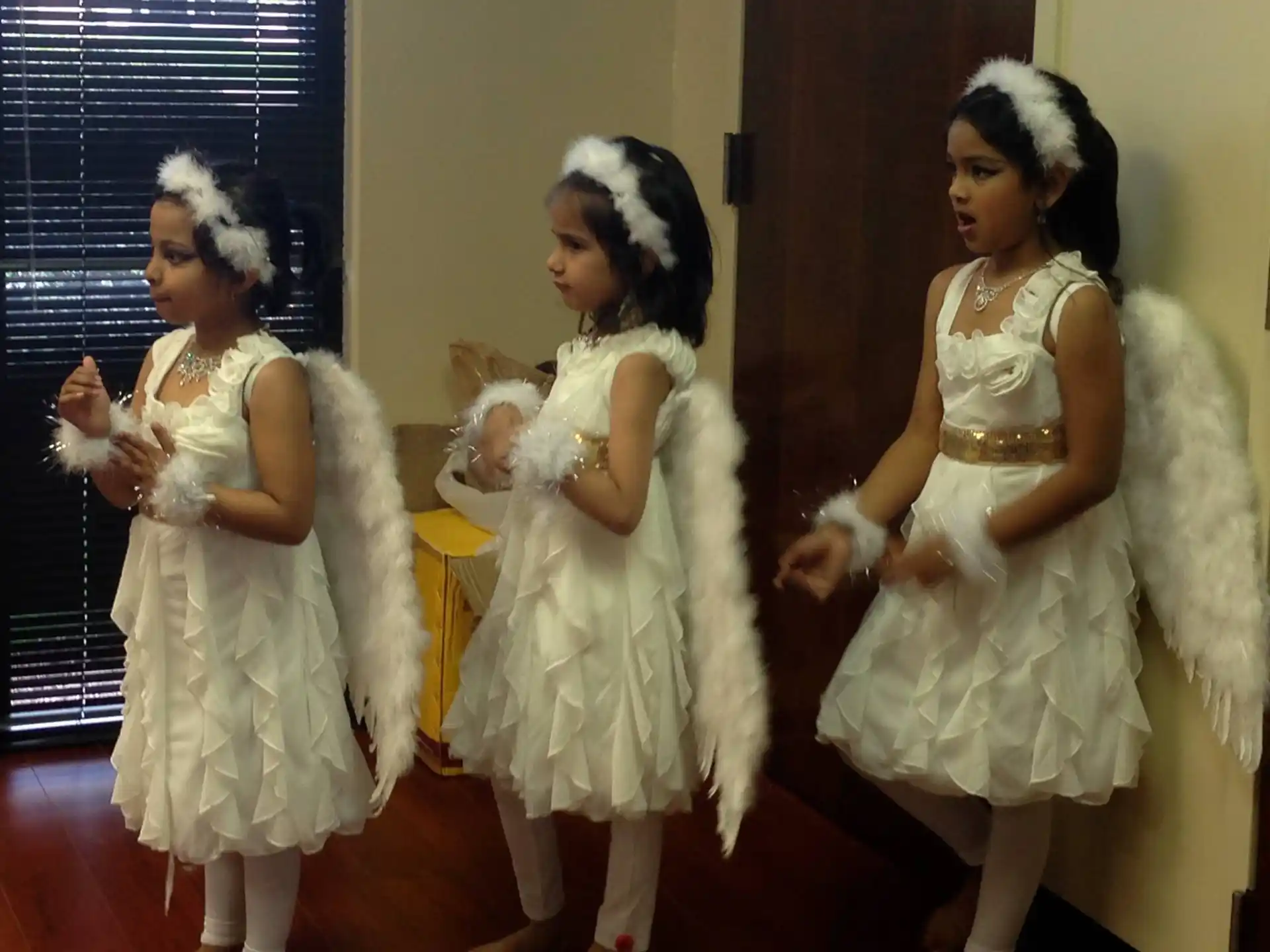 a group of women in white dresses