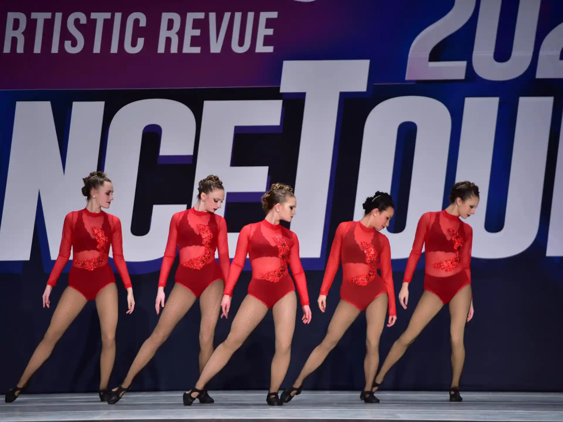 a group of people in red uniforms