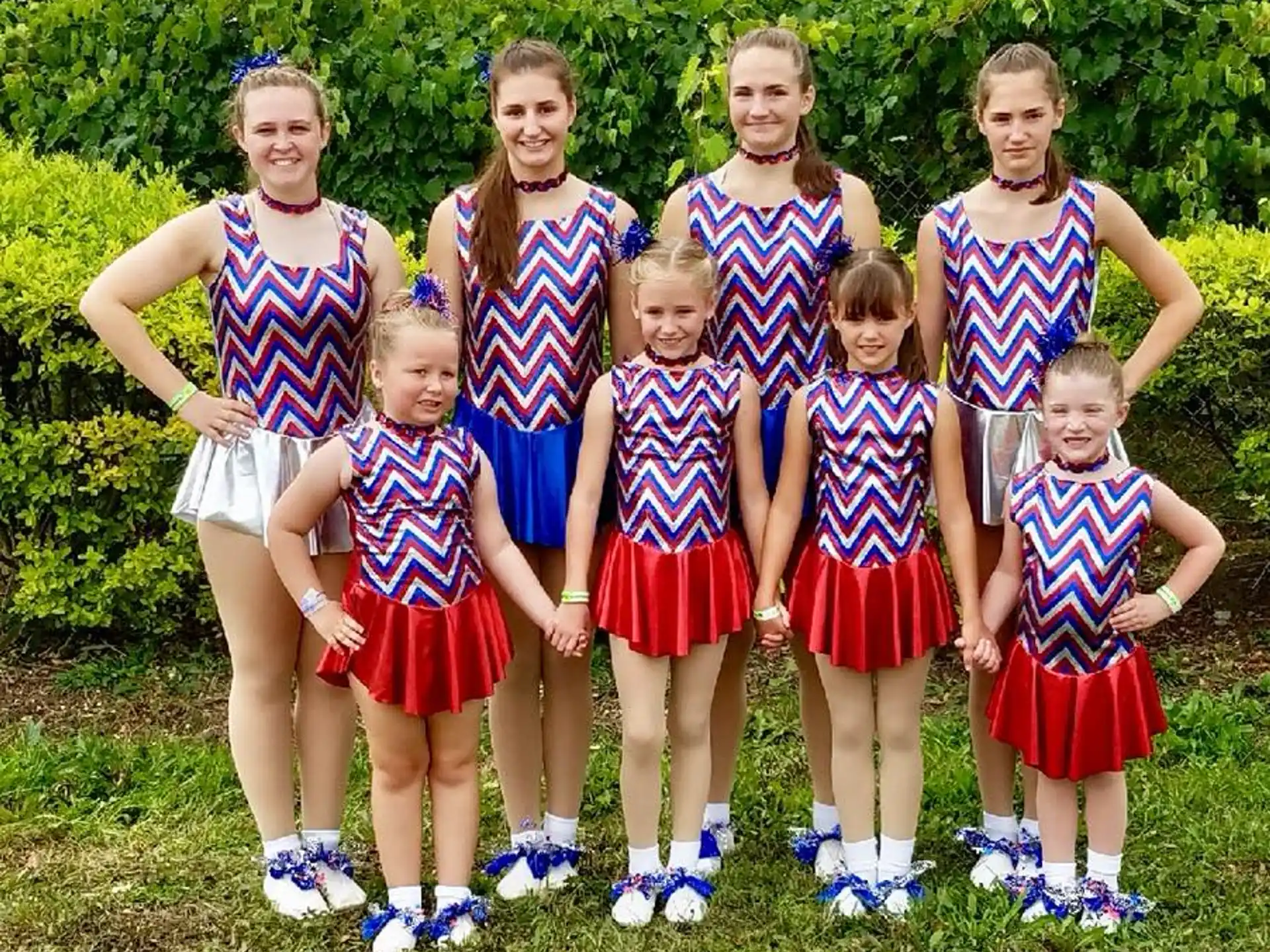 a group of girls posing for a photo