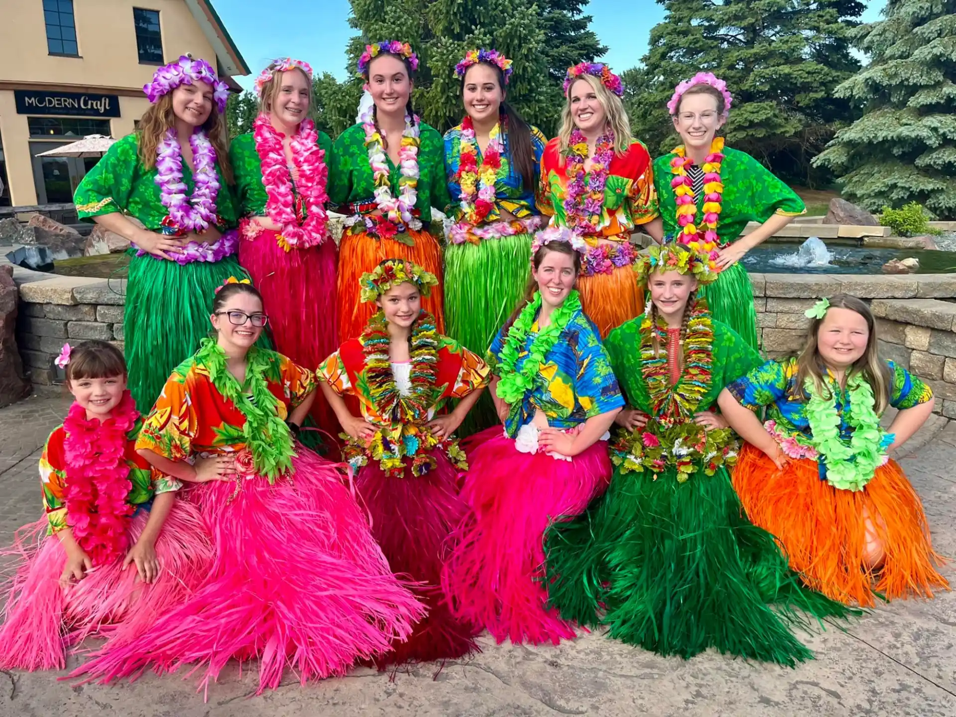 a group of women in colorful dresses