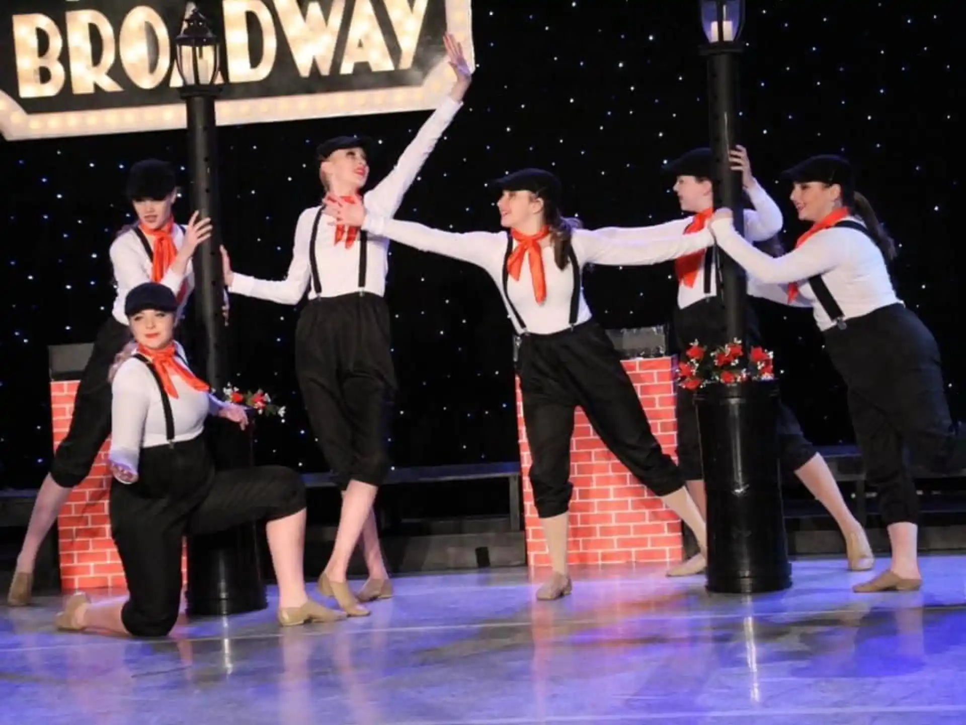 a group of people performing on stage
