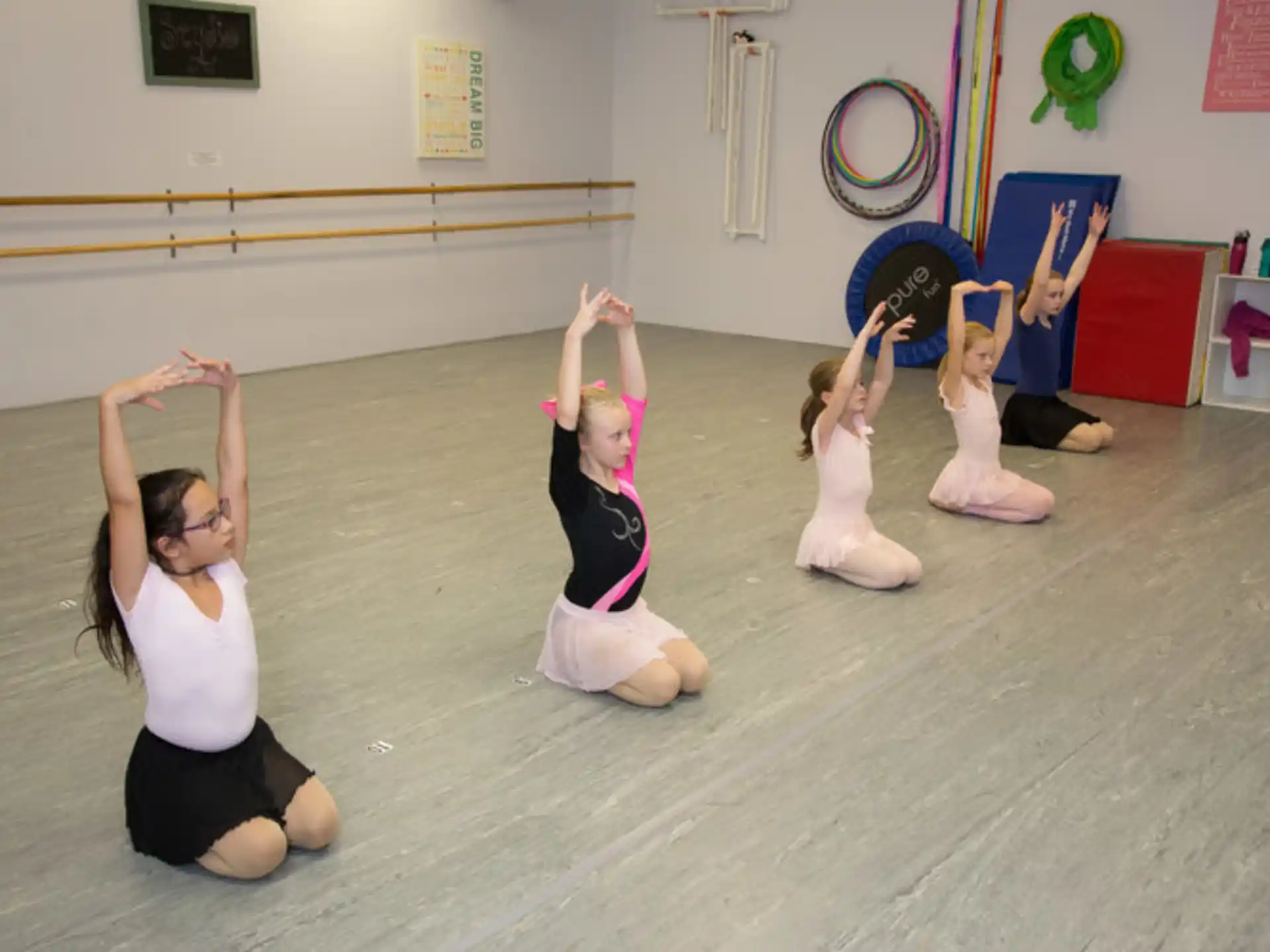 a group of women doing yoga