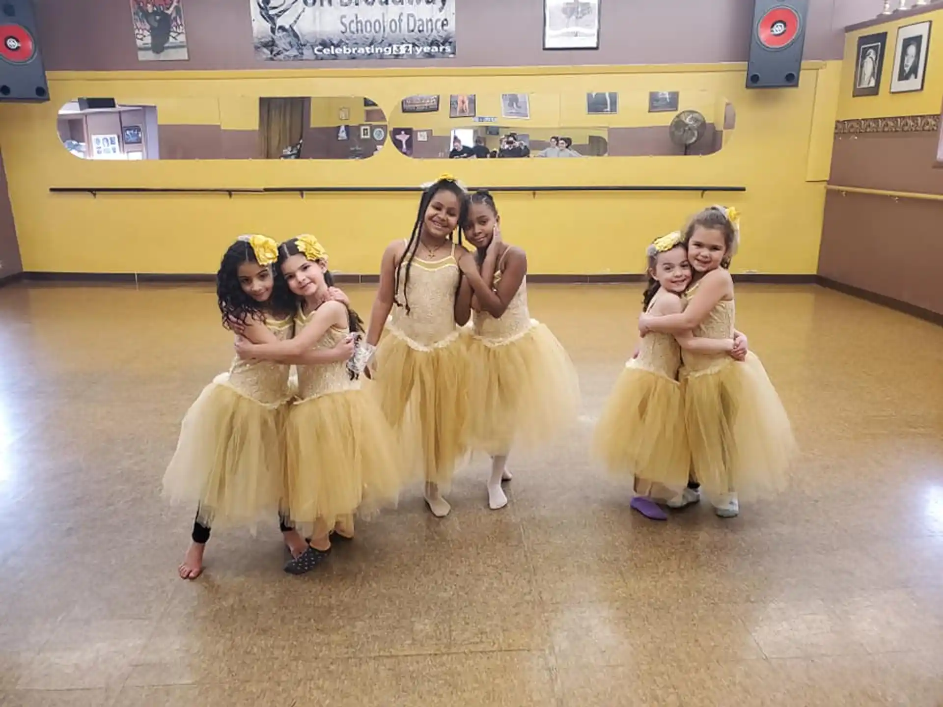a group of girls in dresses