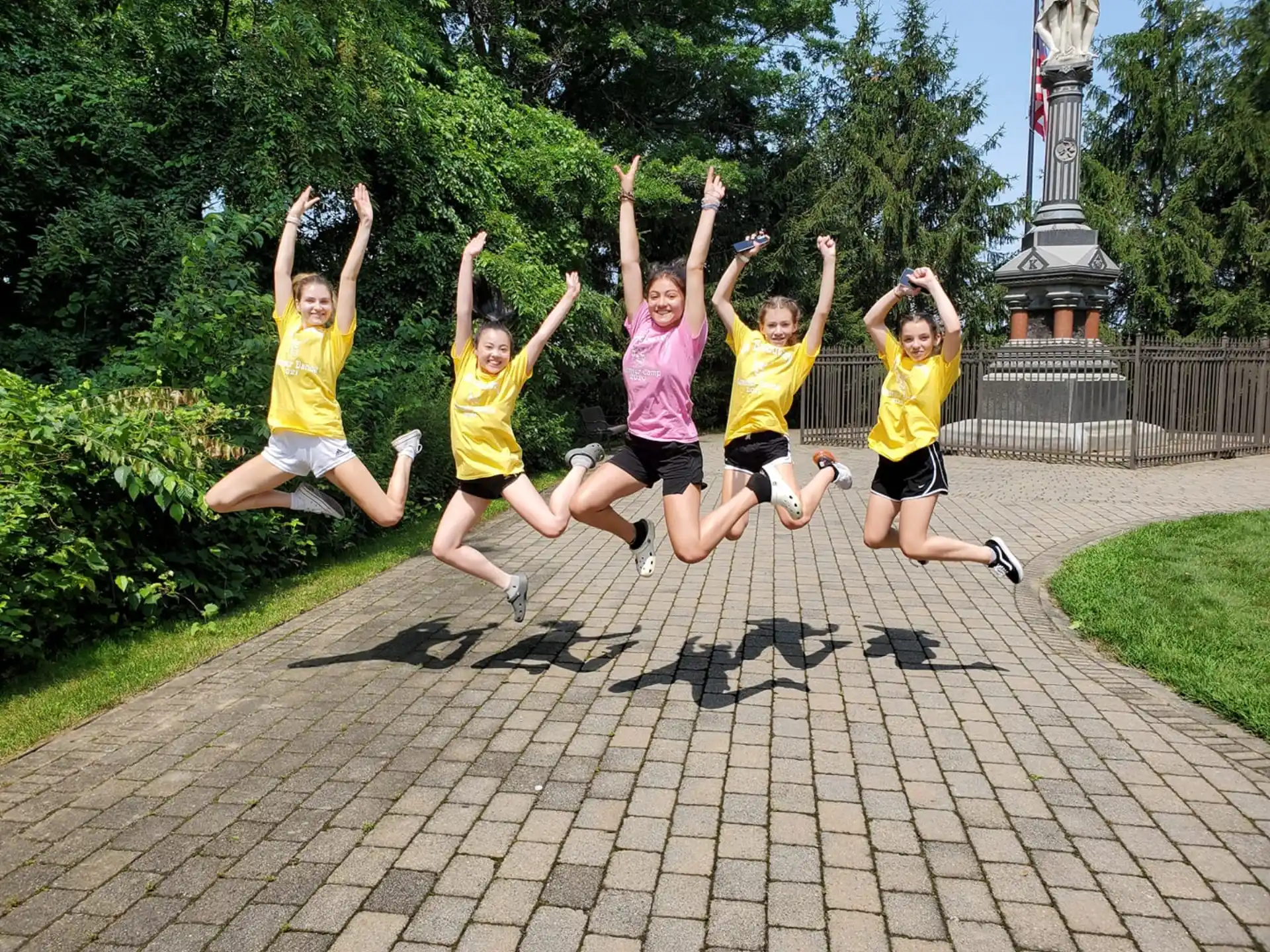 a group of people jumping in the air
