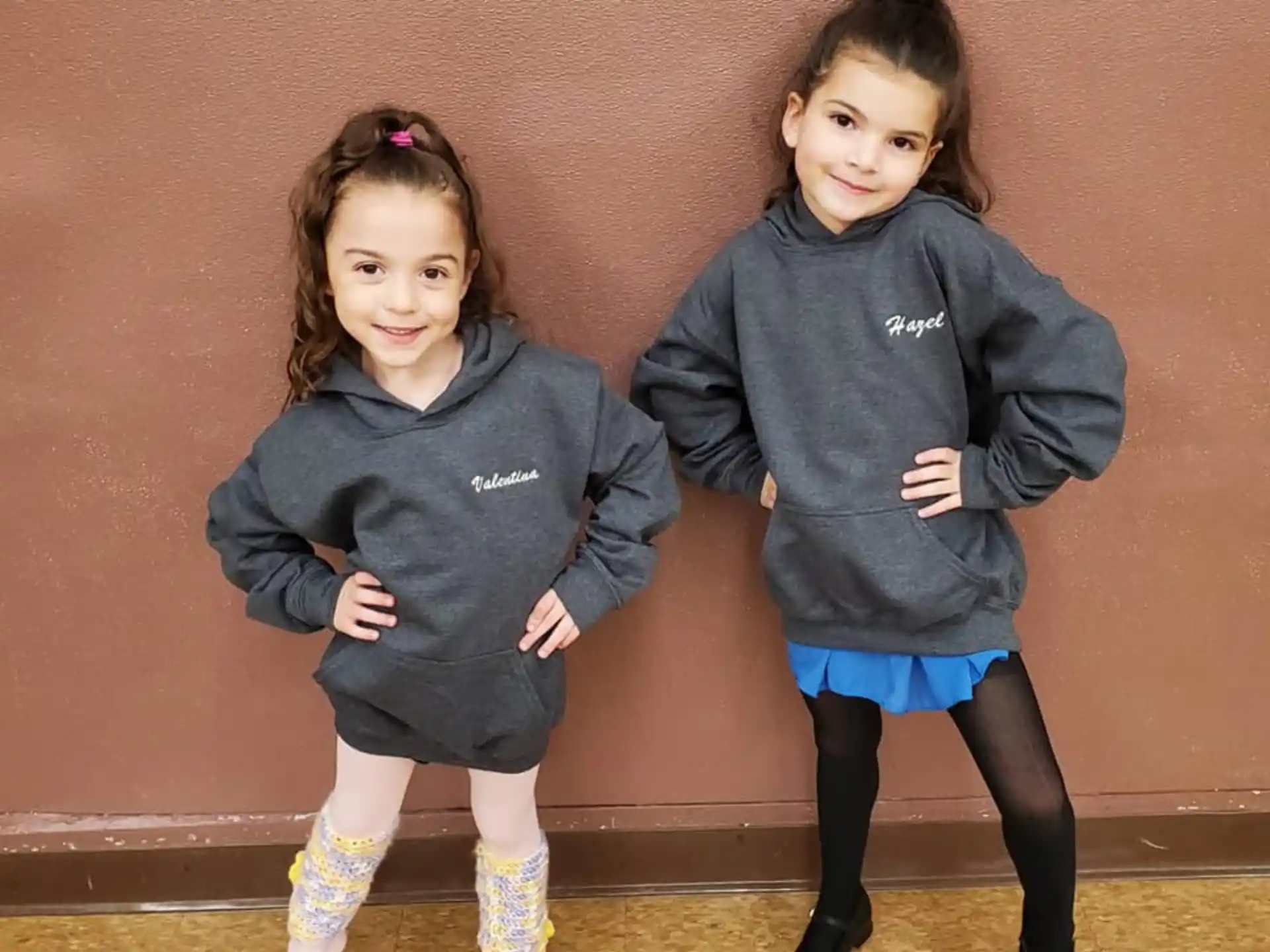 two girls in matching outfits