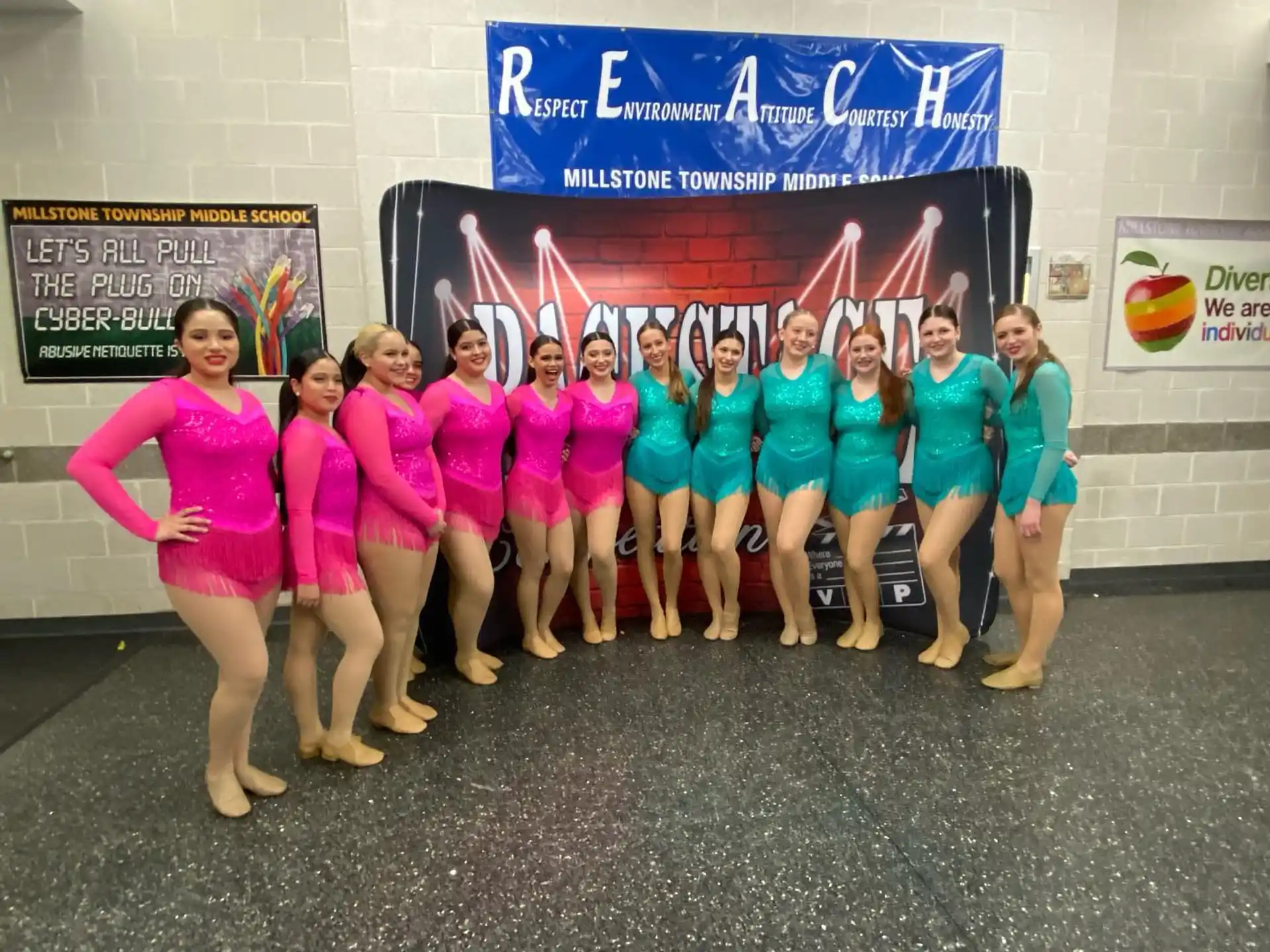 a group of women in pink shirts